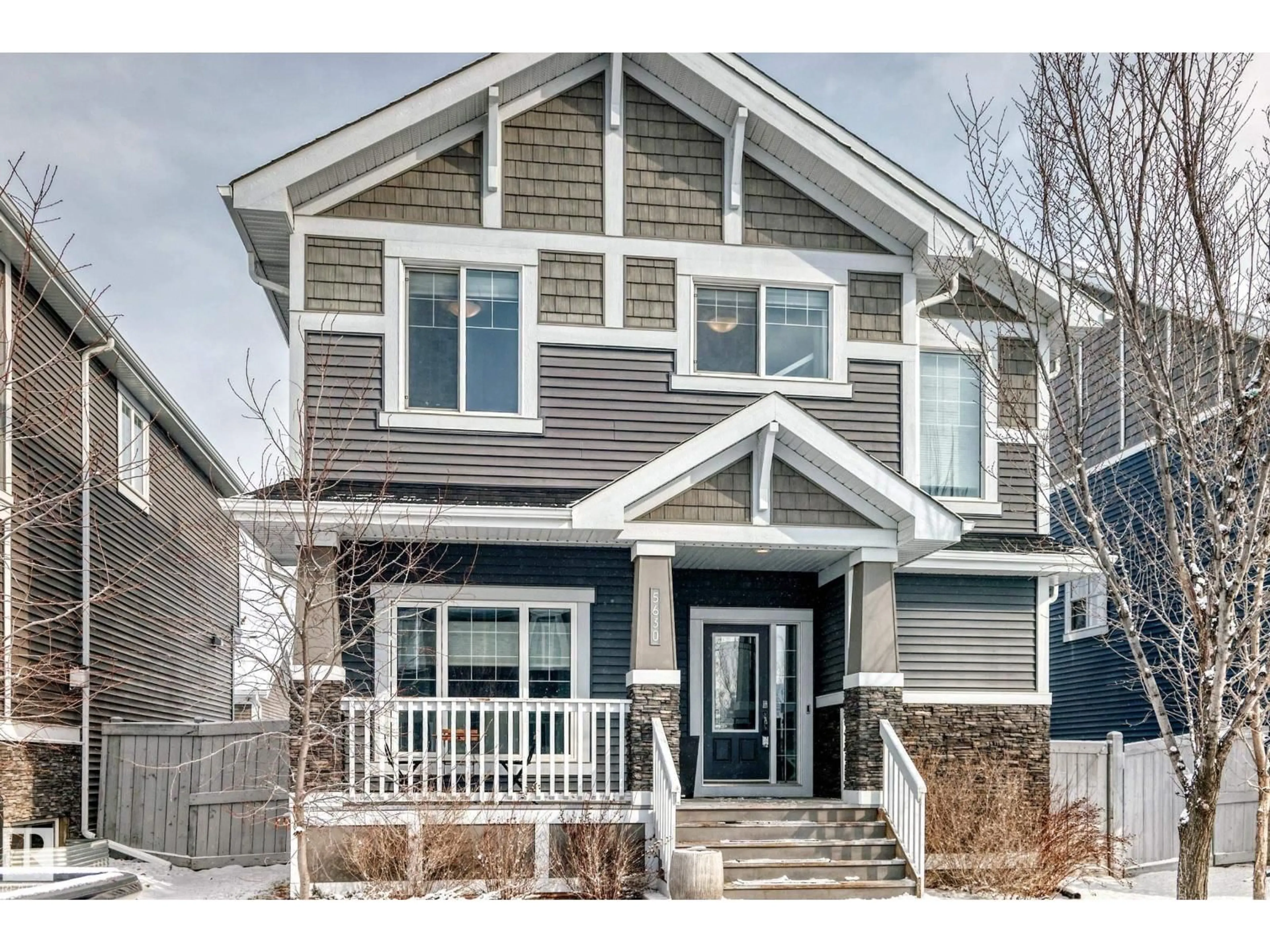Home with vinyl exterior material, street for 5630 JUCHLI AV, Edmonton Alberta T5E6T6