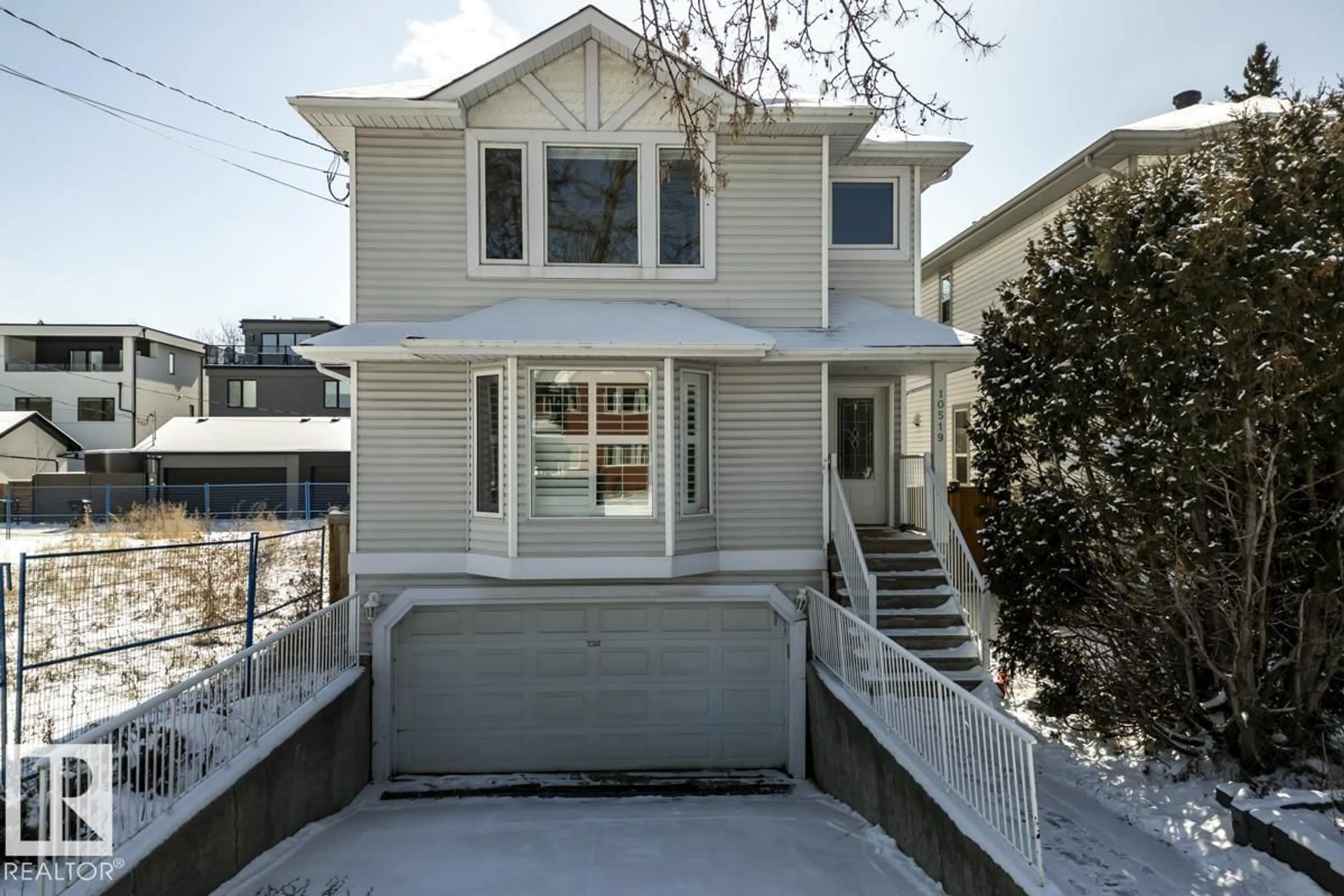 Home with vinyl exterior material, street for NW - 10519 87 AV, Edmonton Alberta T6E2P6