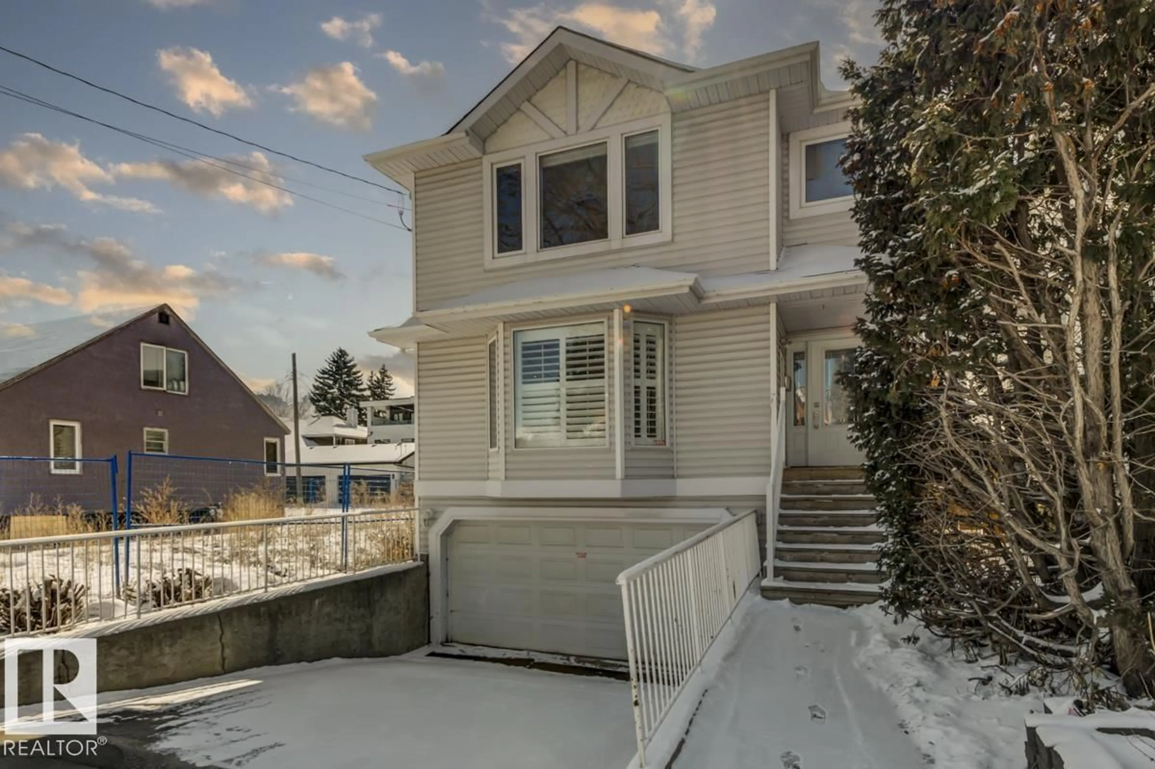 Home with vinyl exterior material, street for NW - 10519 87 AV, Edmonton Alberta T6E2P6