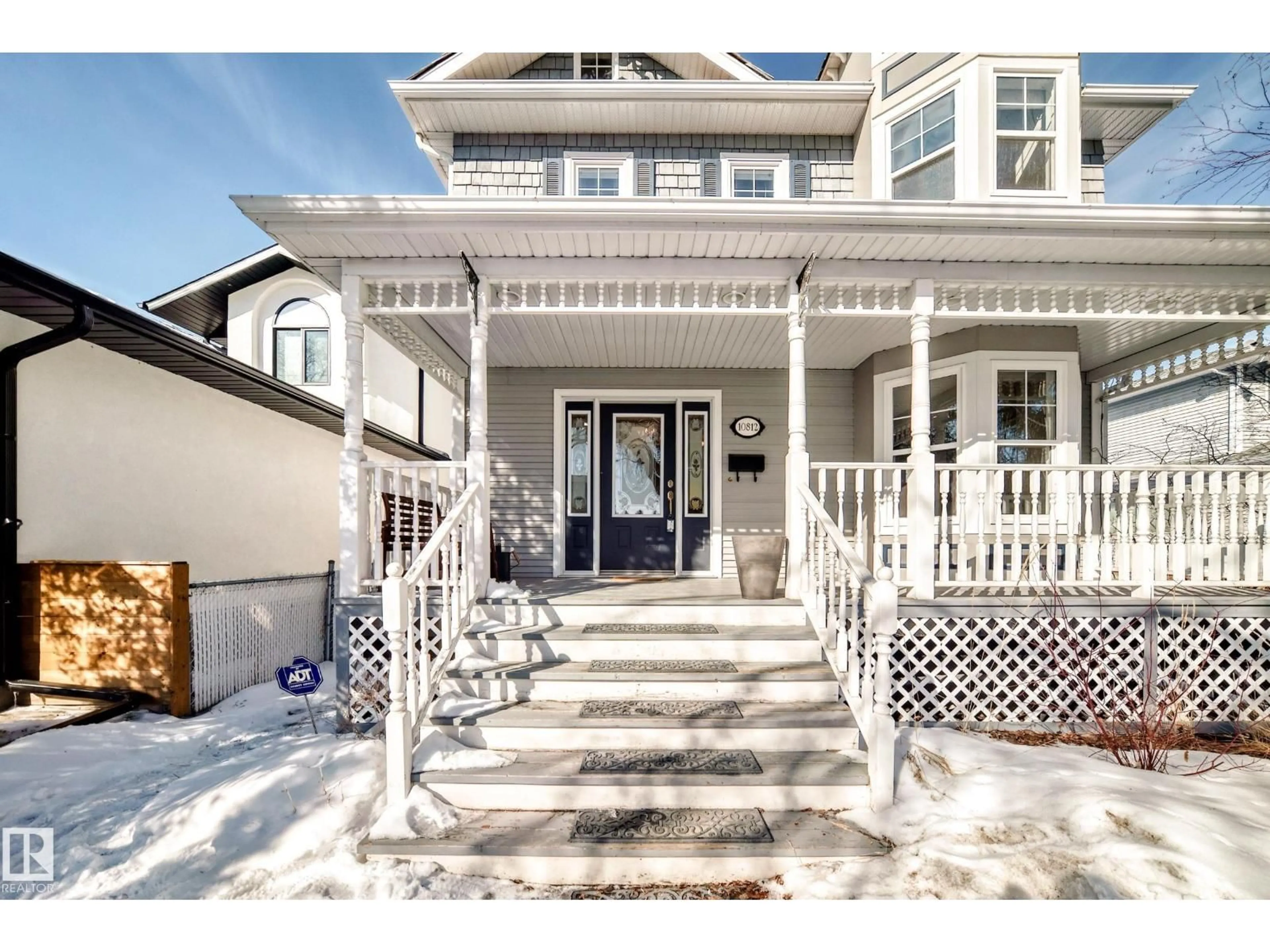 Home with vinyl exterior material, street for NW - 10812 128 ST, Edmonton Alberta T5M0W2