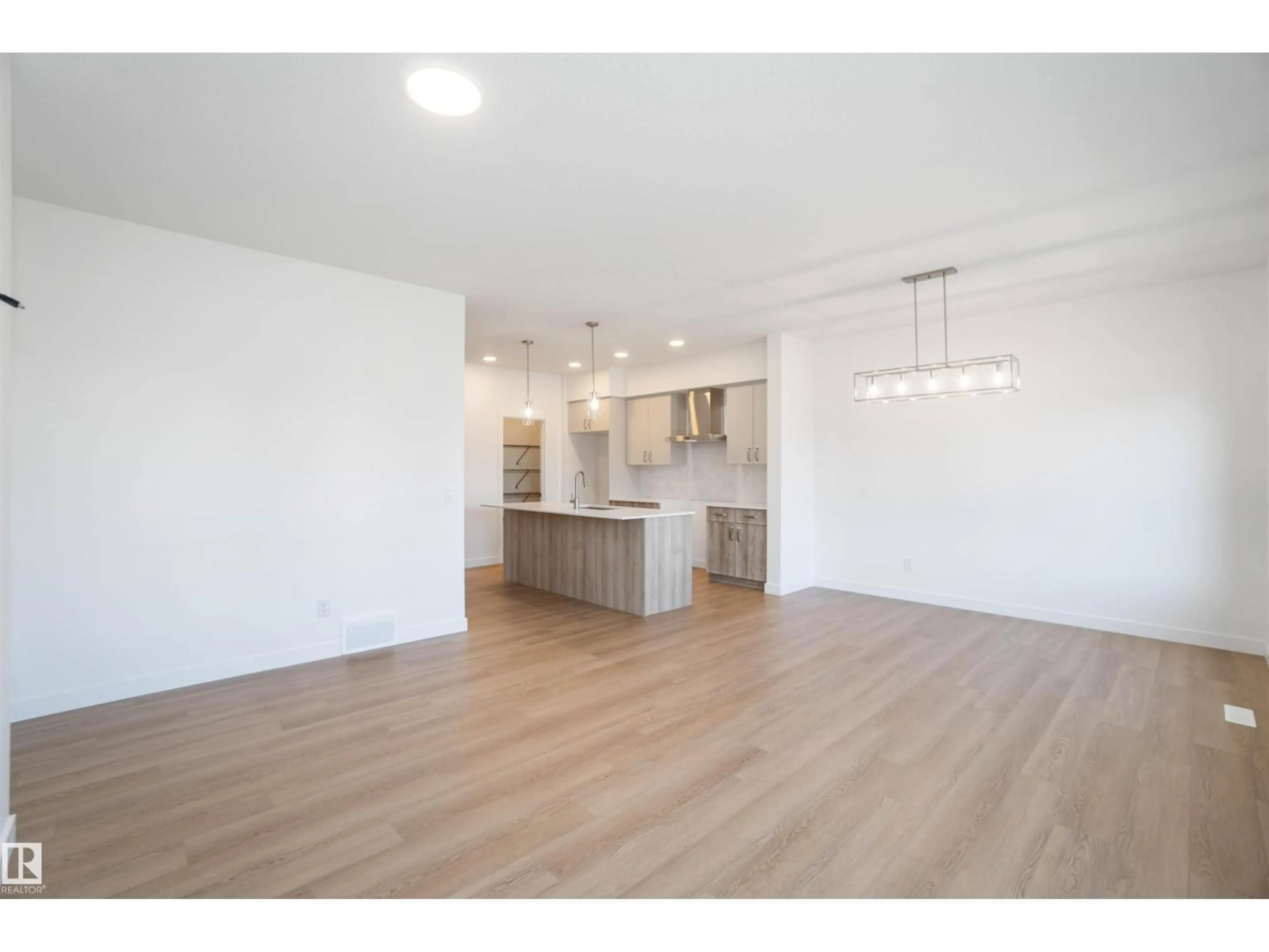 Open concept kitchen, wood/laminate floor for NW - 4027 207 ST, Edmonton Alberta T6M3G1