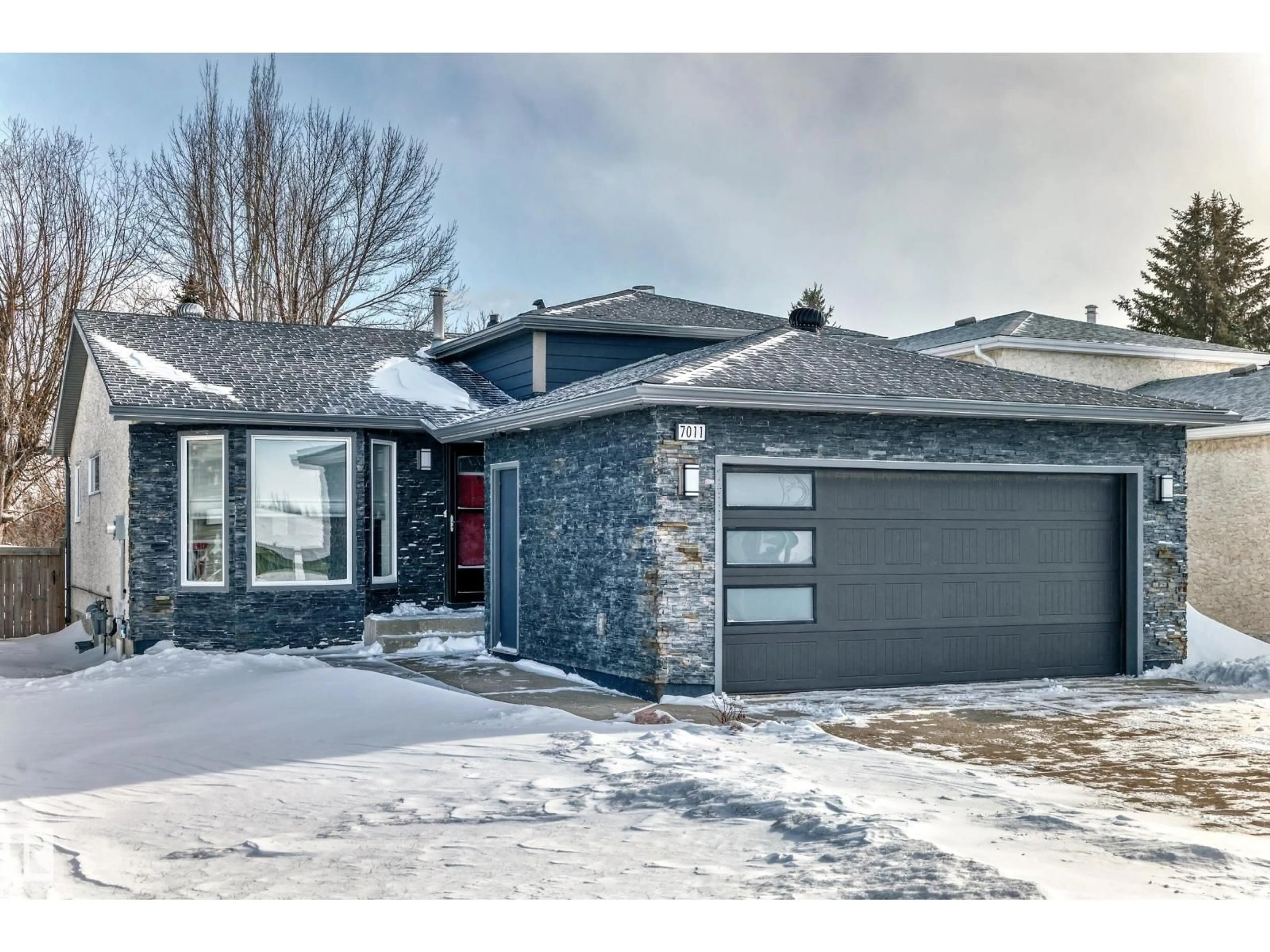 Home with brick exterior material, street for NW - 7011 190B ST, Edmonton Alberta T5T5Z6