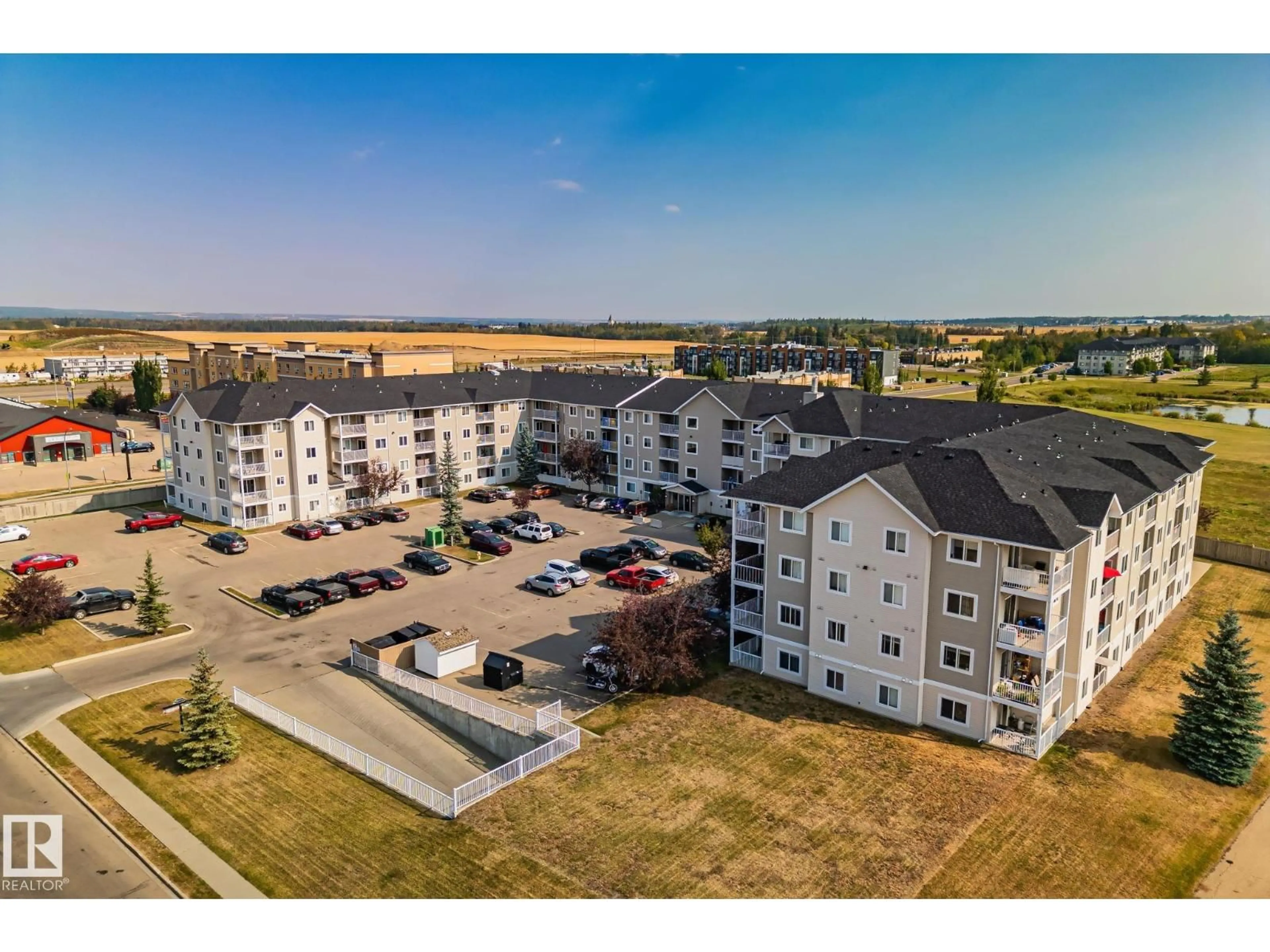 A pic from outside/outdoor area/front of a property/back of a property/a pic from drone, unknown for 105 - 4309 33 ST, Stony Plain Alberta T7Z0C4