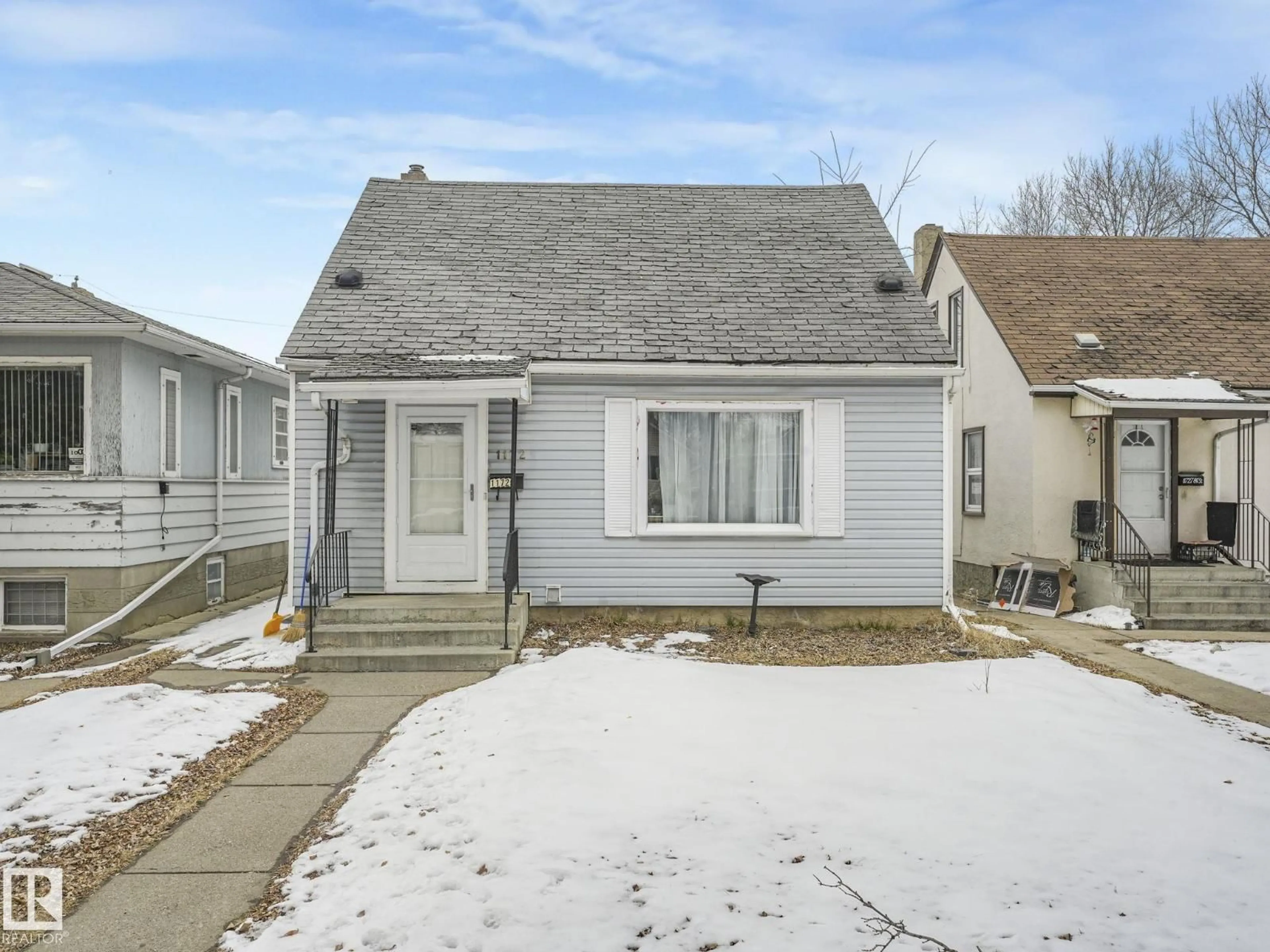 Home with vinyl exterior material, street for NW - 11729 86 ST, Edmonton Alberta T5B3J7