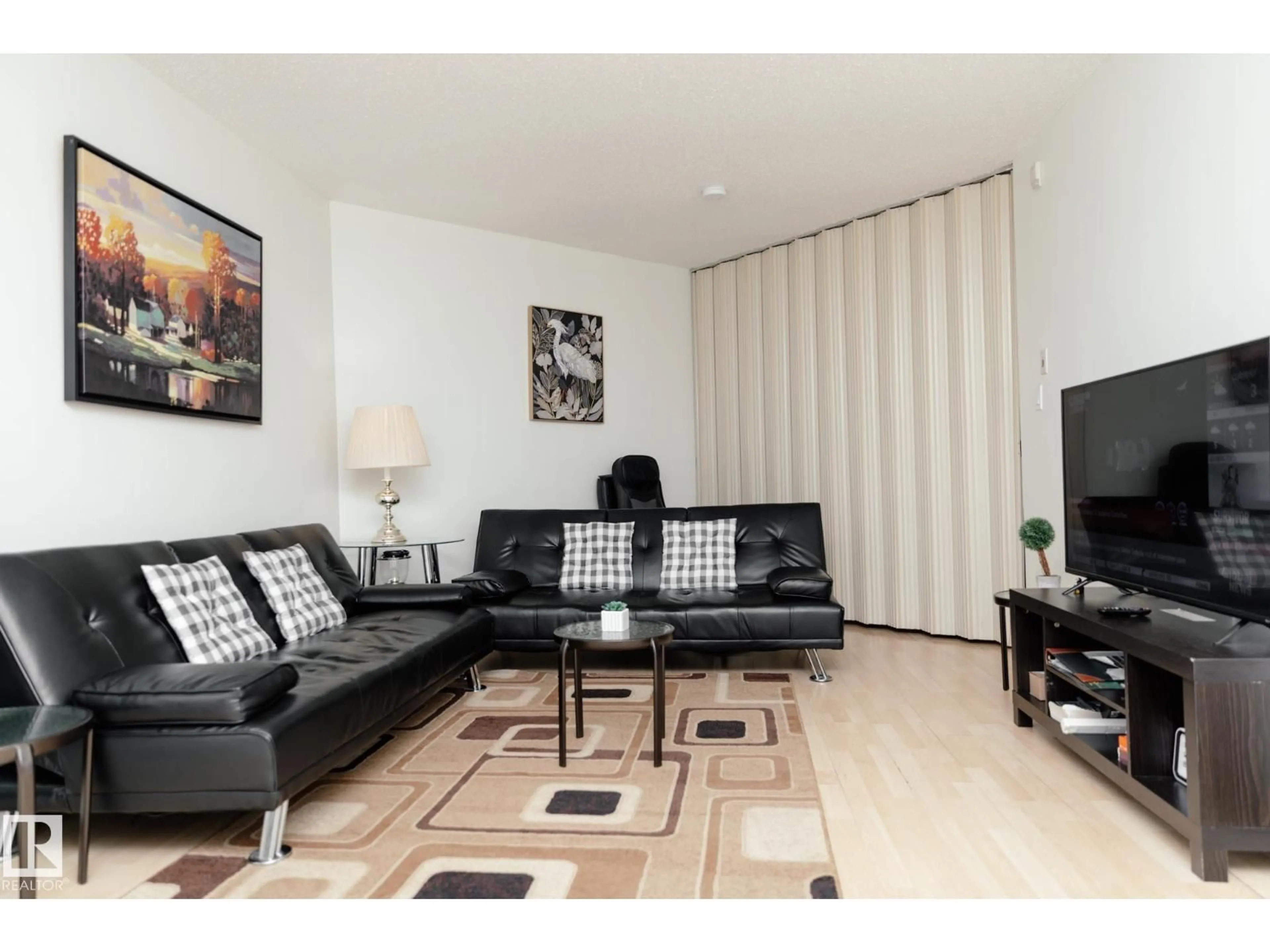 Living room with furniture, wood/laminate floor for 42 - 11245 31 AV, Edmonton Alberta T6J3V5