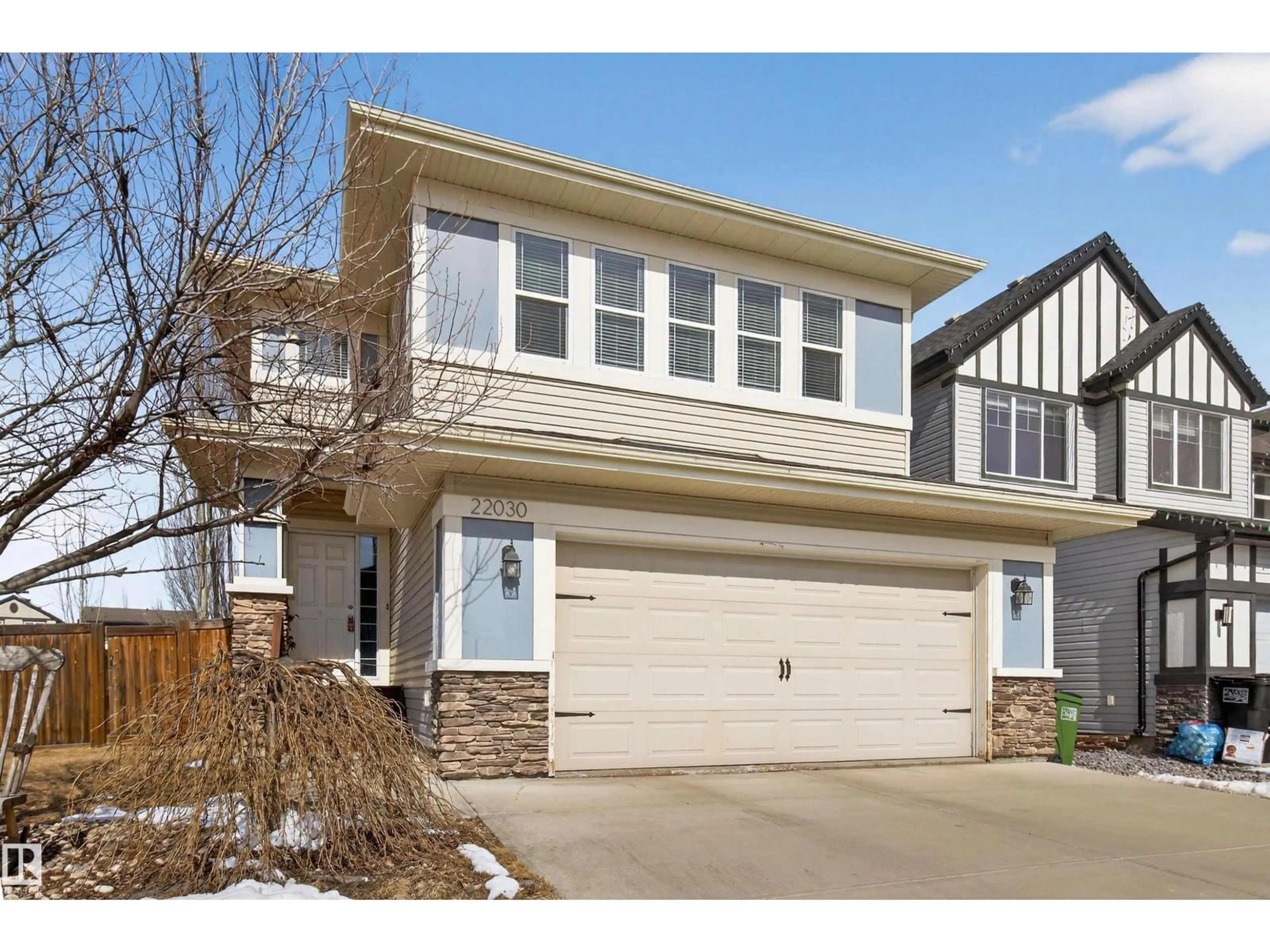 Home with vinyl exterior material, street for 22030 95A AV, Edmonton Alberta T5T4A9