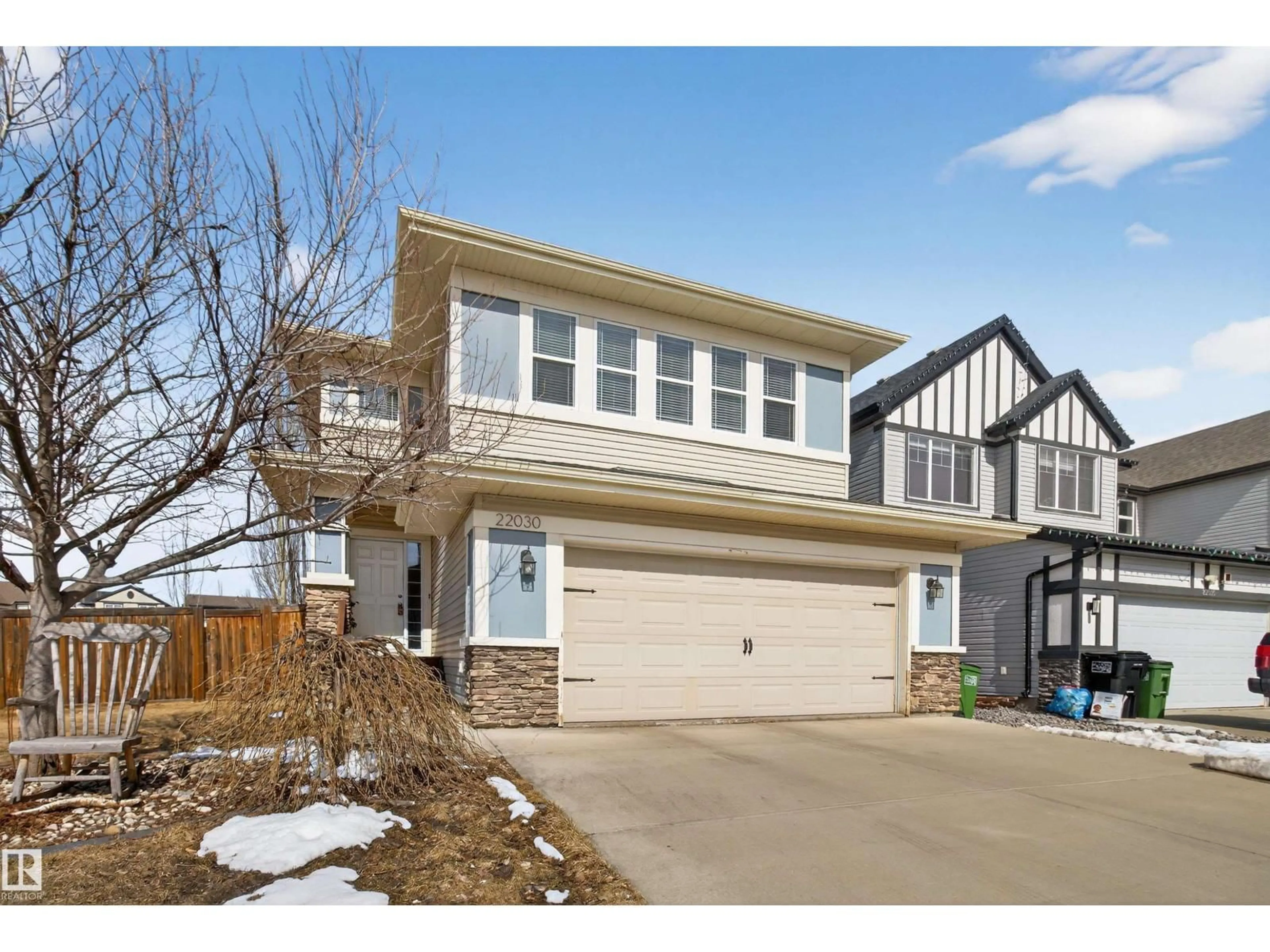 Home with vinyl exterior material, street for 22030 95A AV, Edmonton Alberta T5T4A9