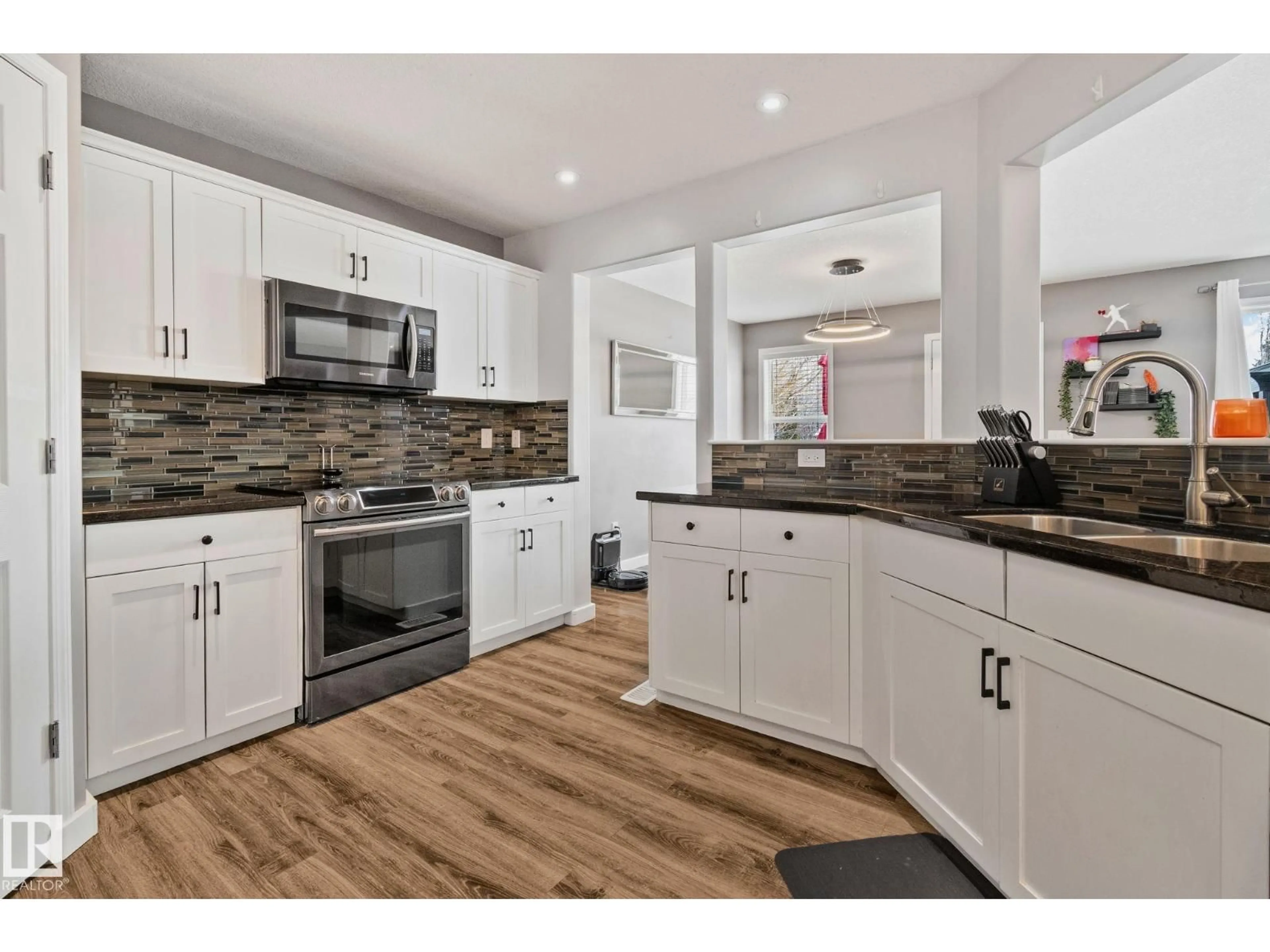 Open concept kitchen, unknown for 3711 161 AV, Edmonton Alberta T5Y3G2