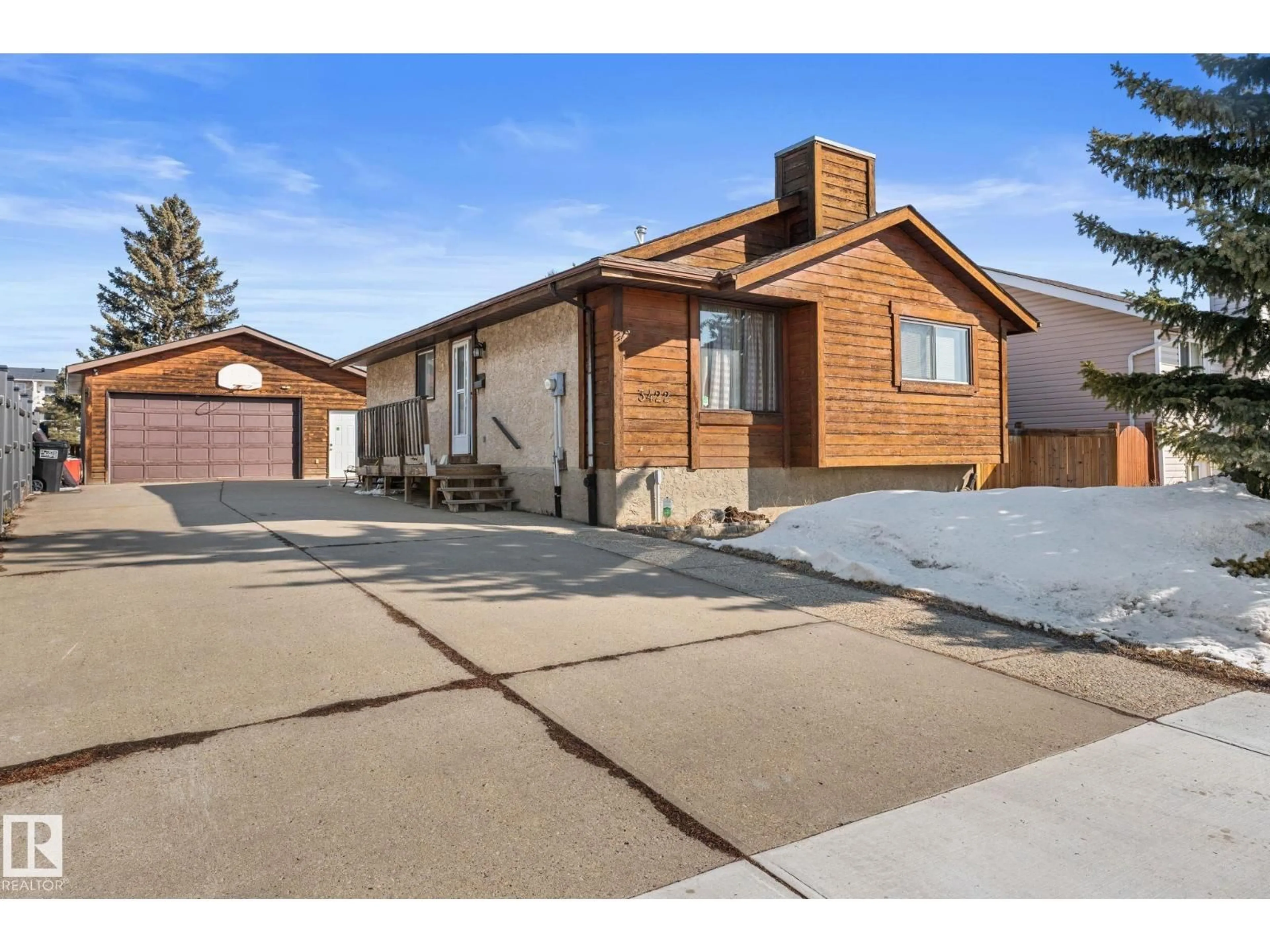 Home with brick exterior material, street for 3422 138A AV NW, Edmonton Alberta T5Y1S4