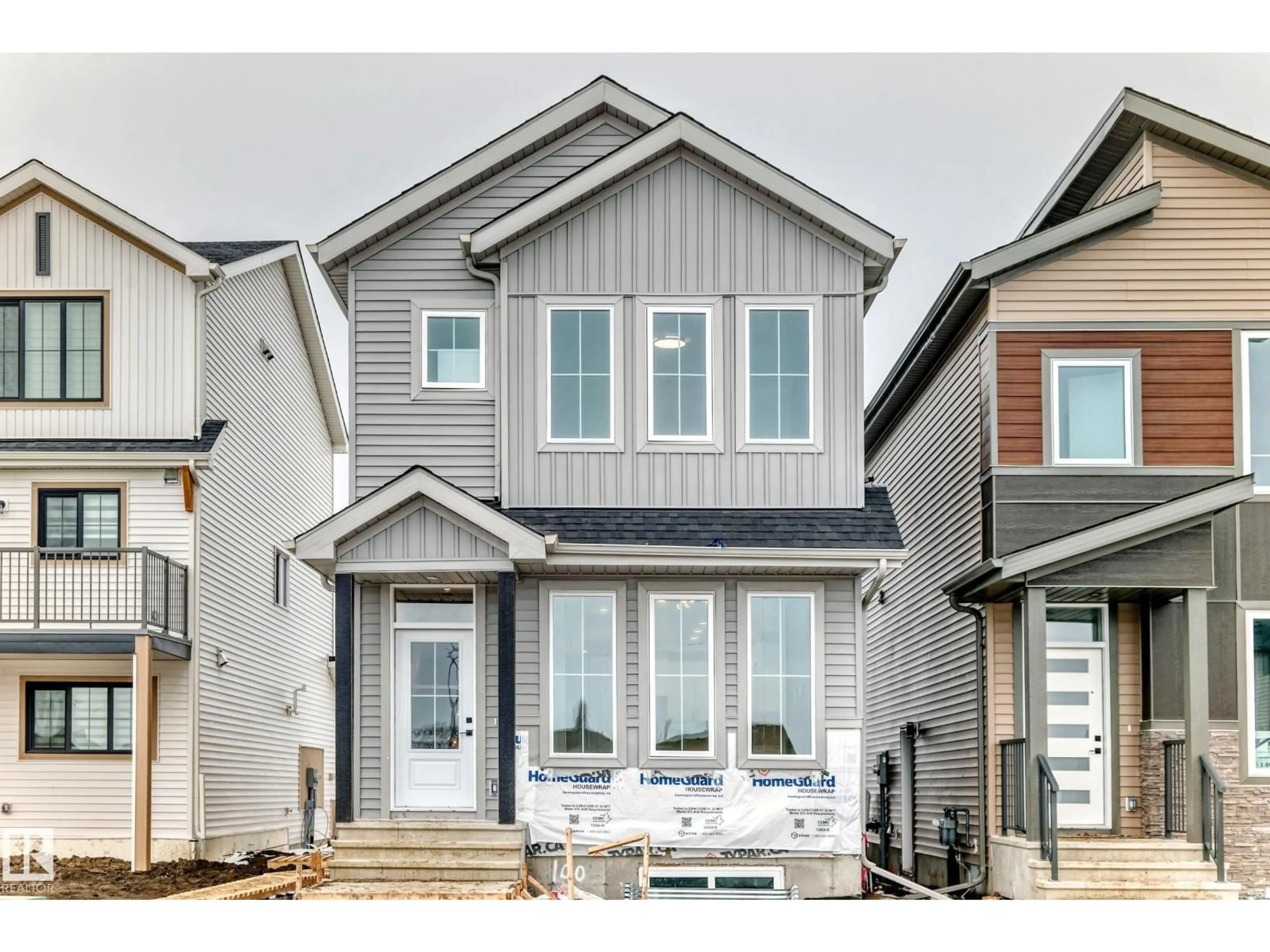 Home with vinyl exterior material, street for 100 ELLIOTT WD, Fort Saskatchewan Alberta T8L1R8
