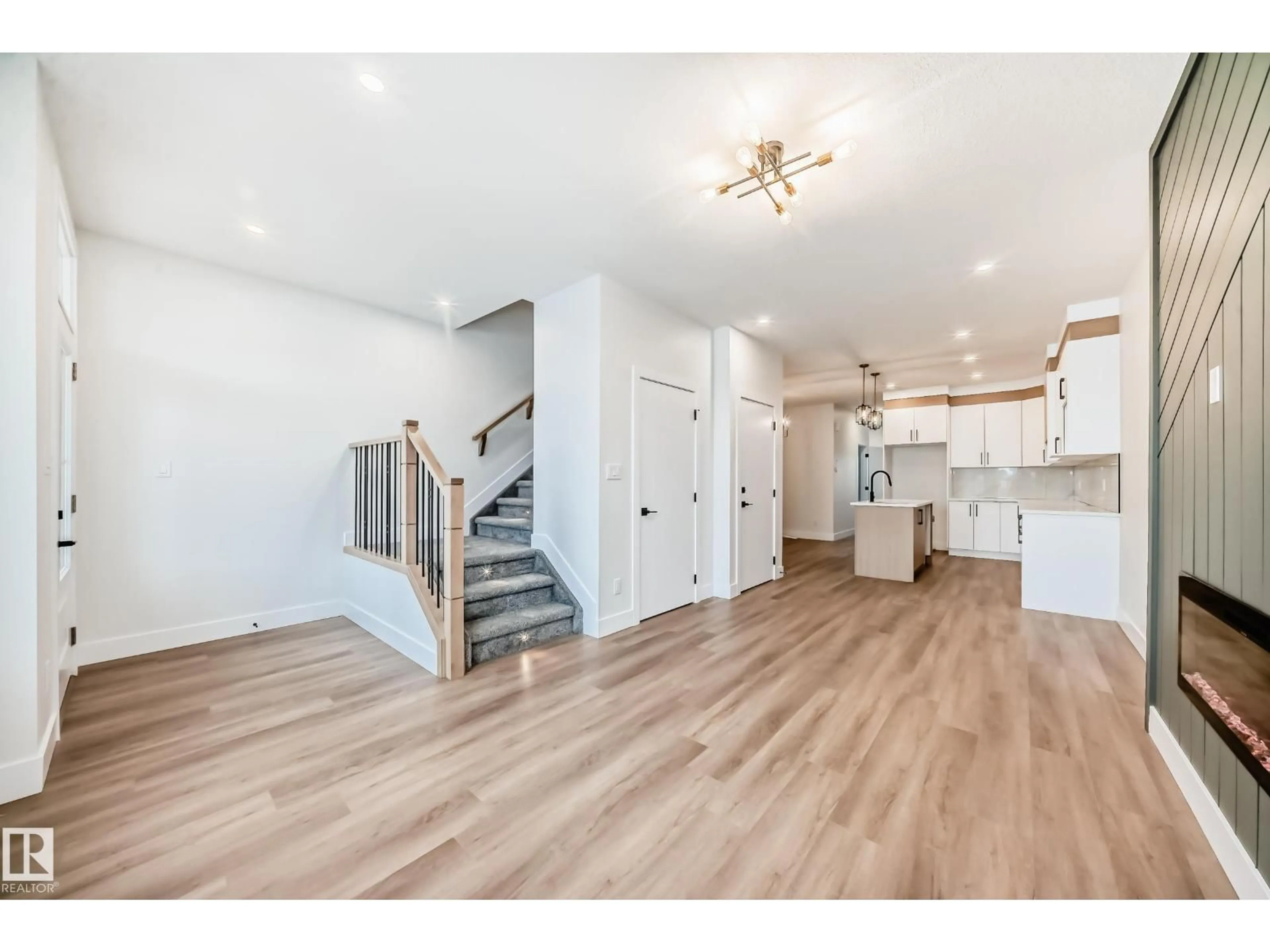 Open concept kitchen, wood/laminate floor for 100 ELLIOTT WD, Fort Saskatchewan Alberta T8L1R8