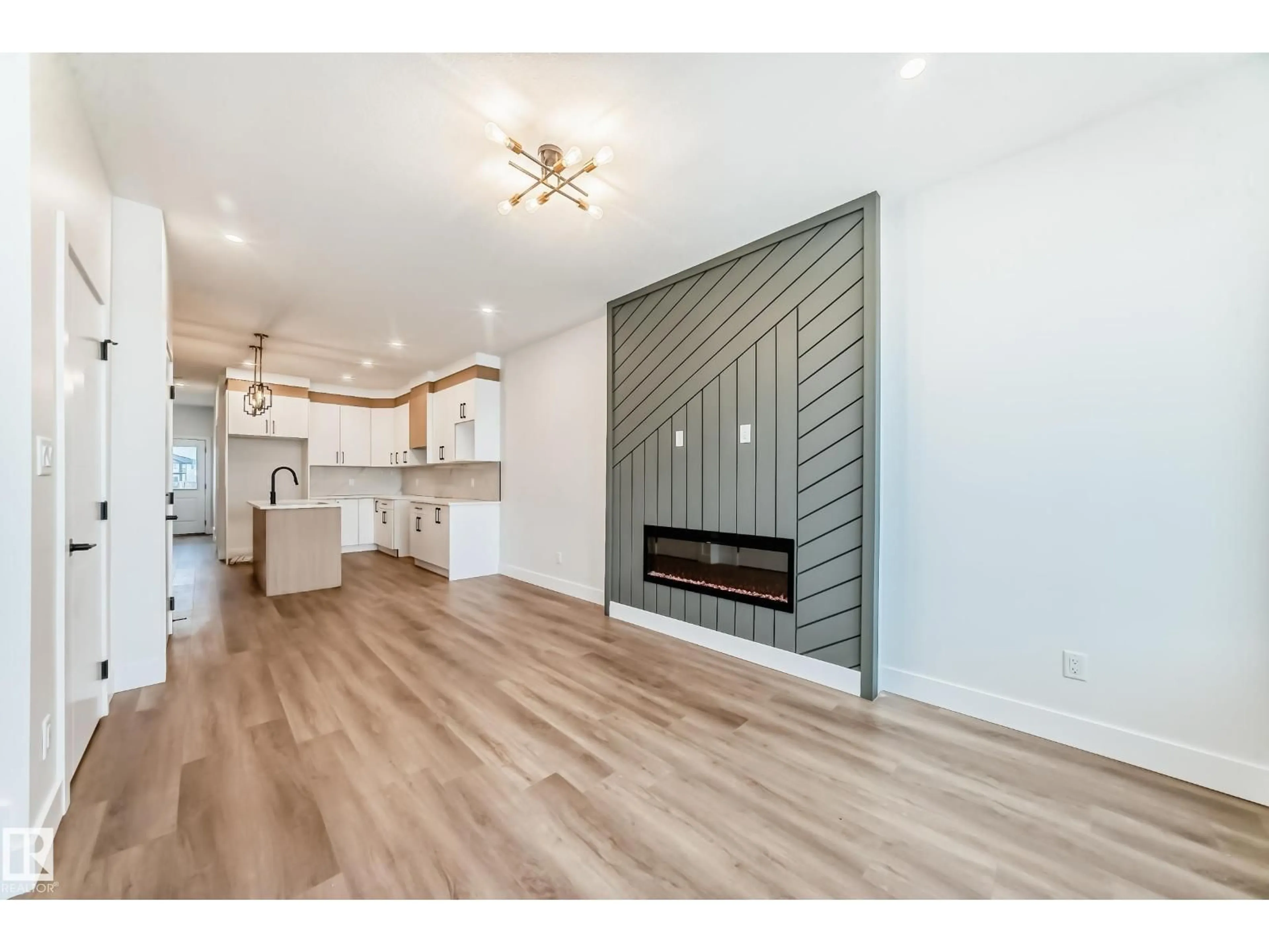 Open concept kitchen, wood/laminate floor for 100 ELLIOTT WD, Fort Saskatchewan Alberta T8L1R8
