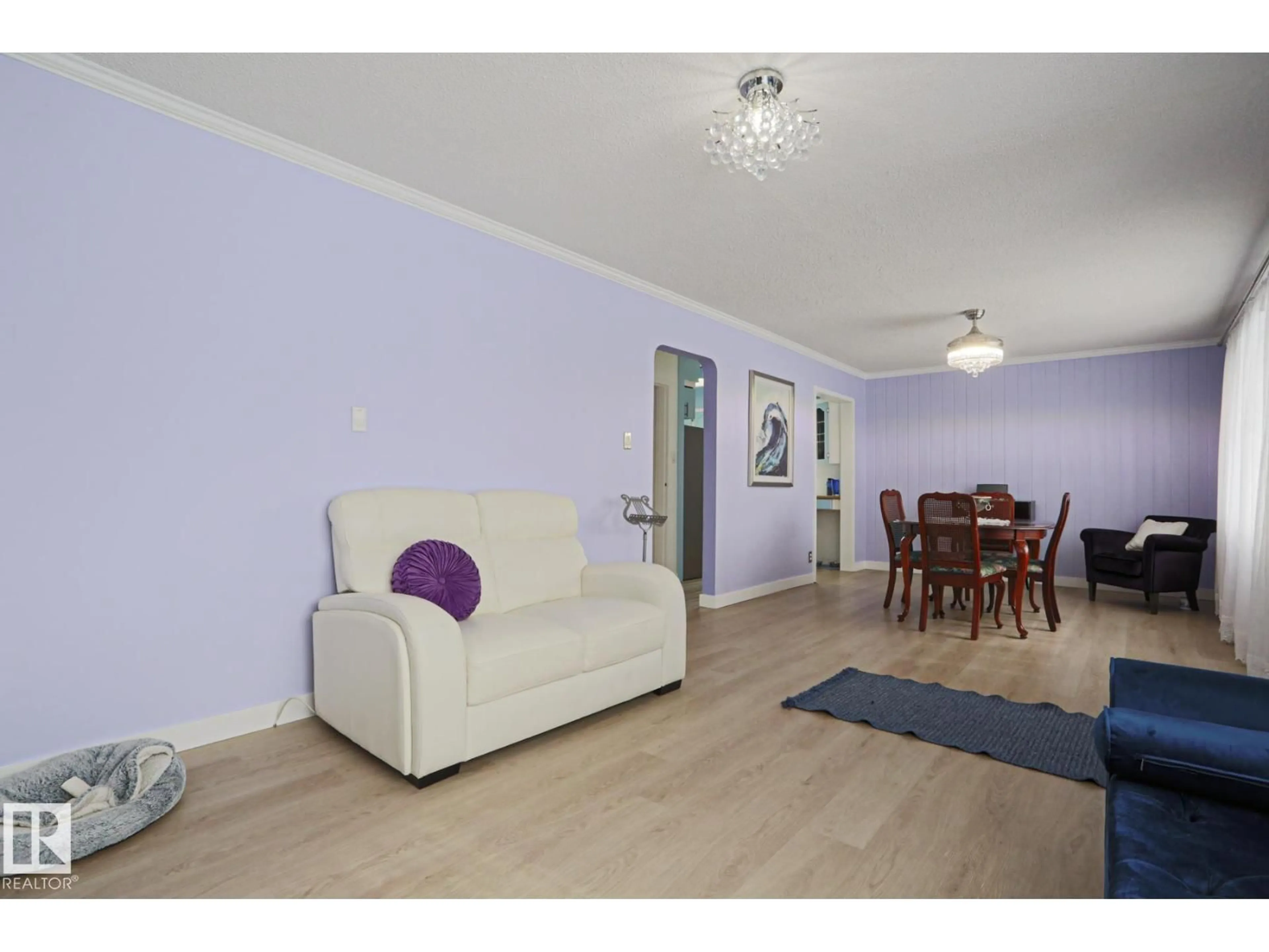 Living room with furniture, wood/laminate floor for 13520 124A AV, Edmonton Alberta T5L3B5