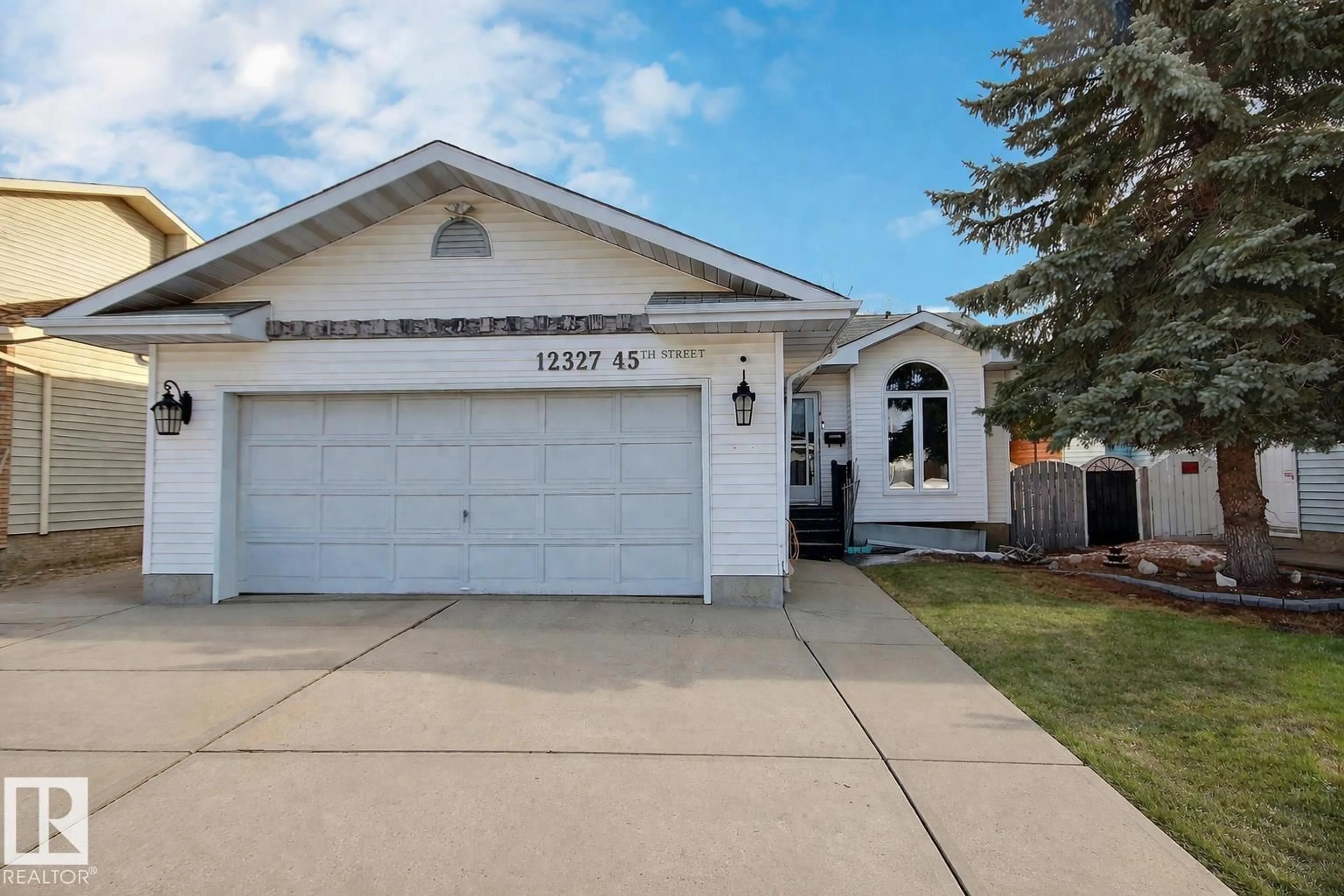 Home with vinyl exterior material, street for NW - 12327 45 ST, Edmonton Alberta T5W5C3