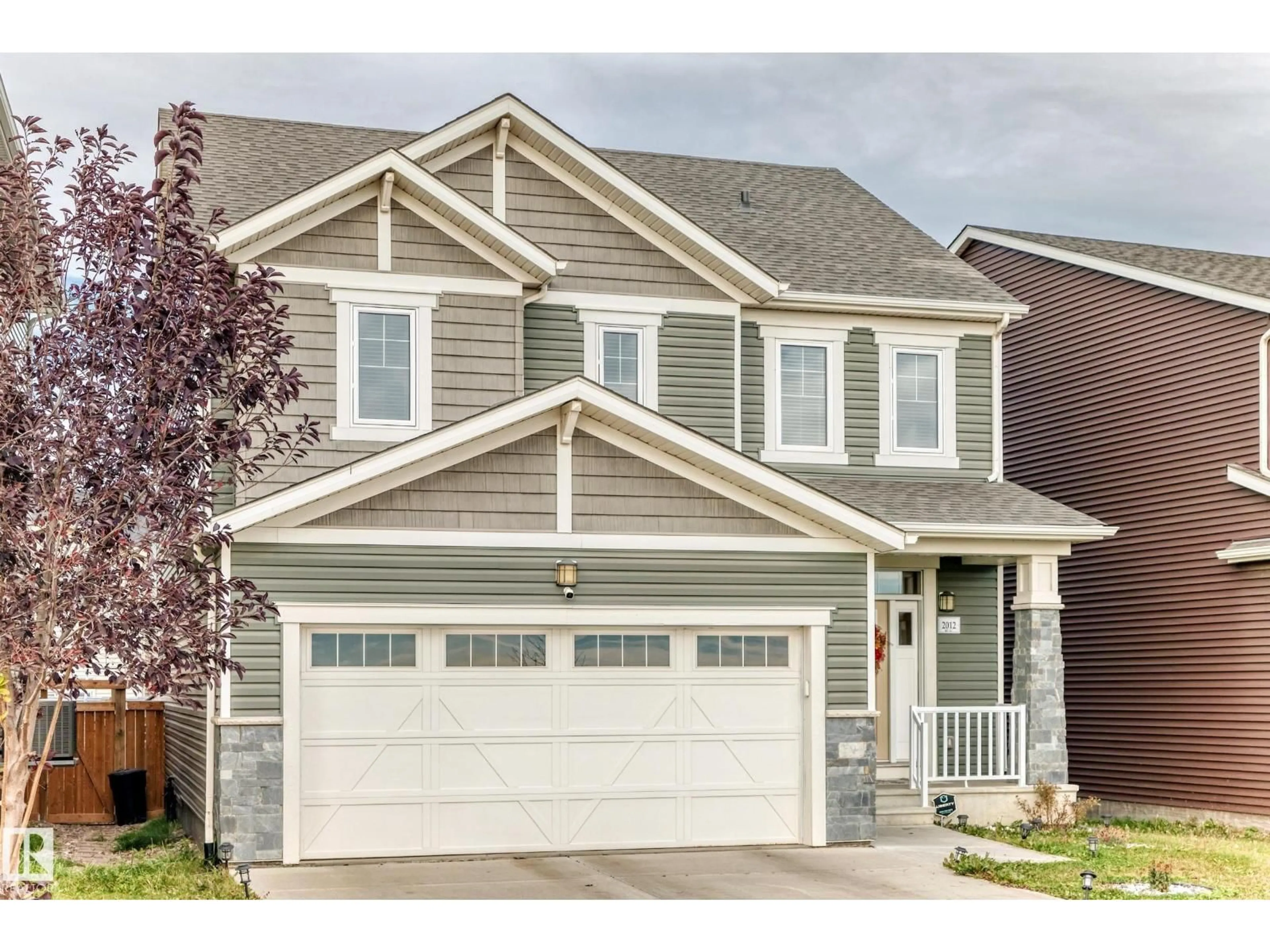 Home with vinyl exterior material, street for 2012 200 ST NW, Edmonton Alberta T6M0X7