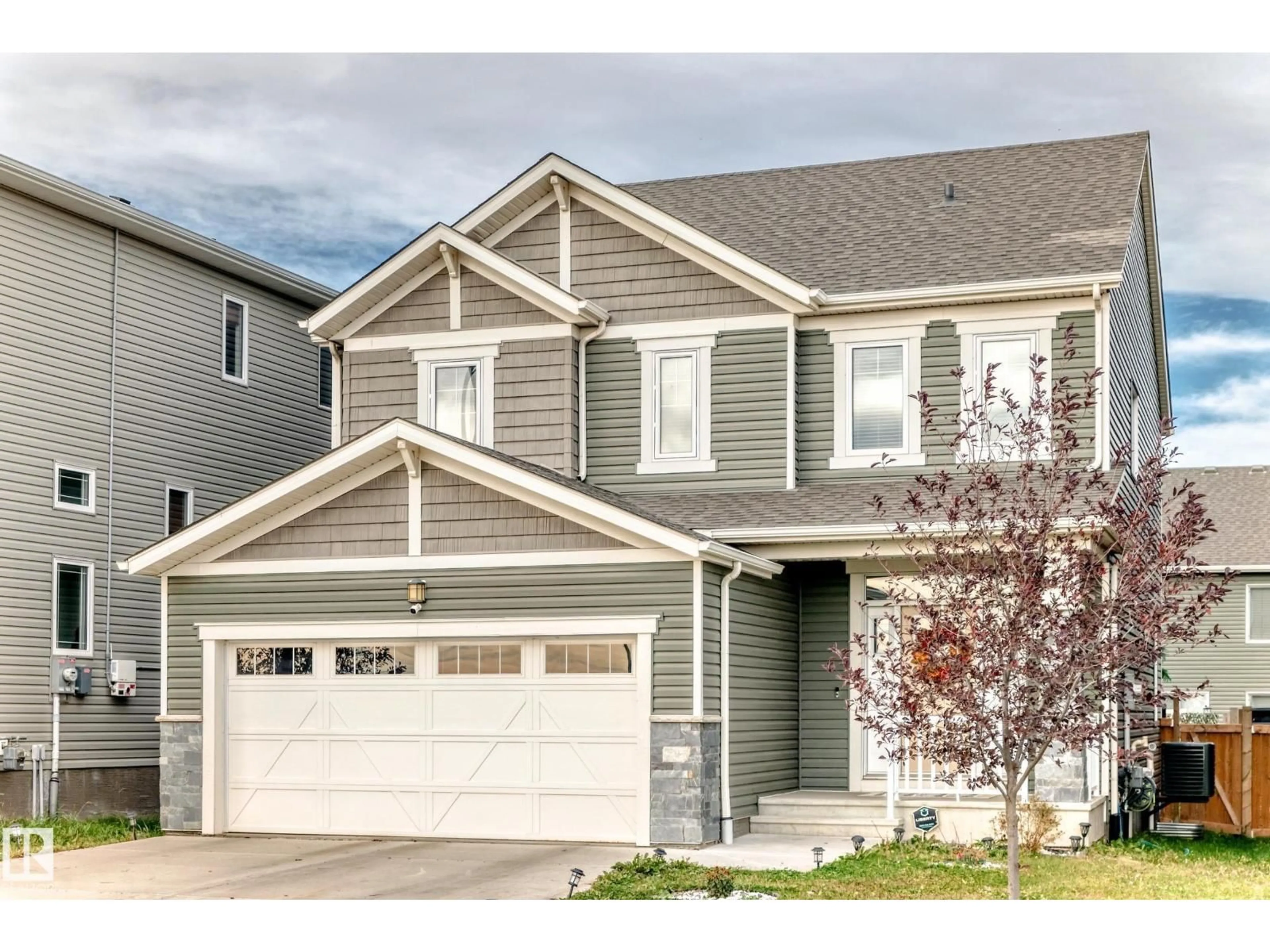 Home with vinyl exterior material, street for 2012 200 ST NW, Edmonton Alberta T6M0X7