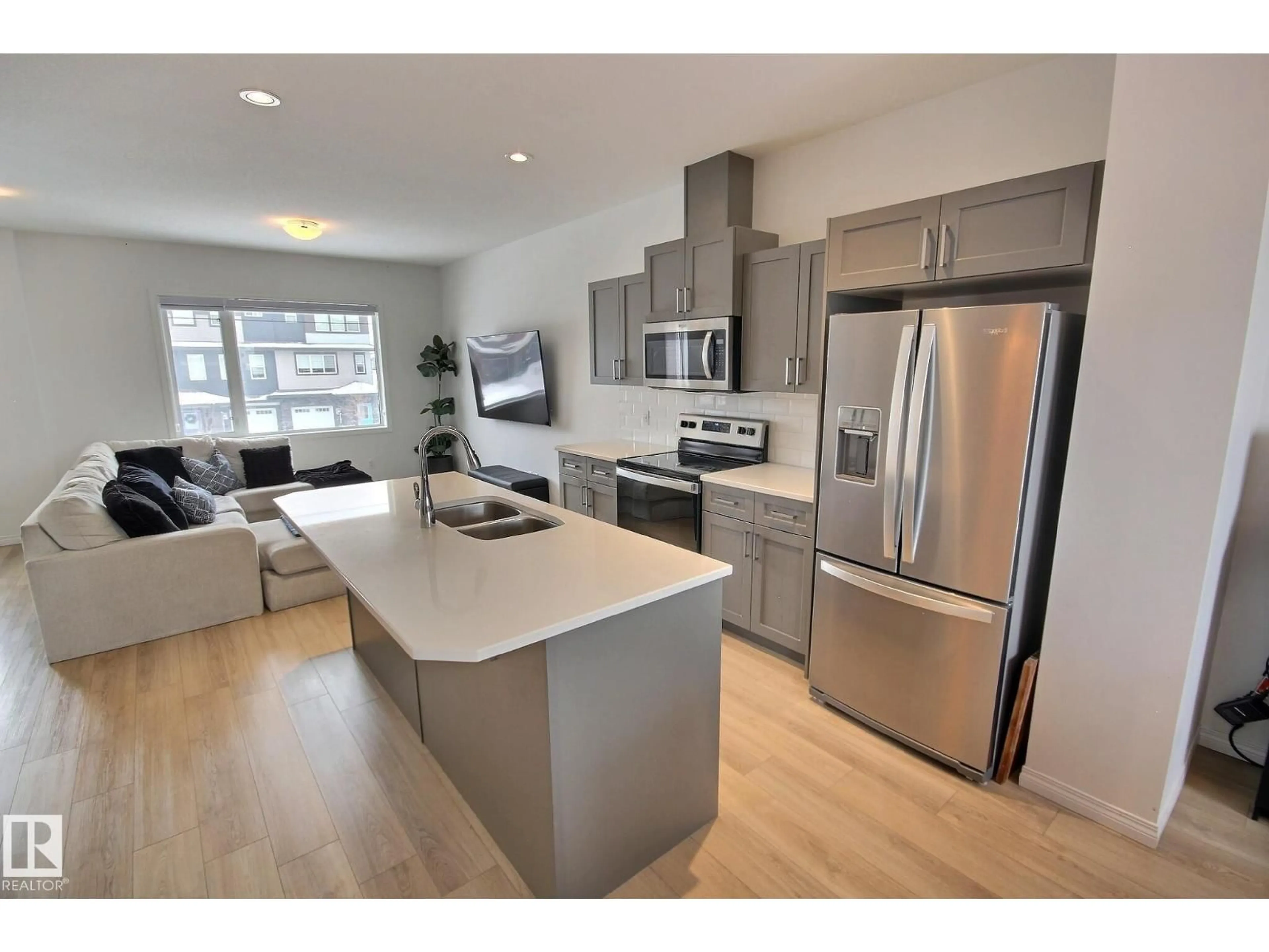 Open concept kitchen, wood/laminate floor for SW - 1512 157 ST, Edmonton Alberta T6W4J8