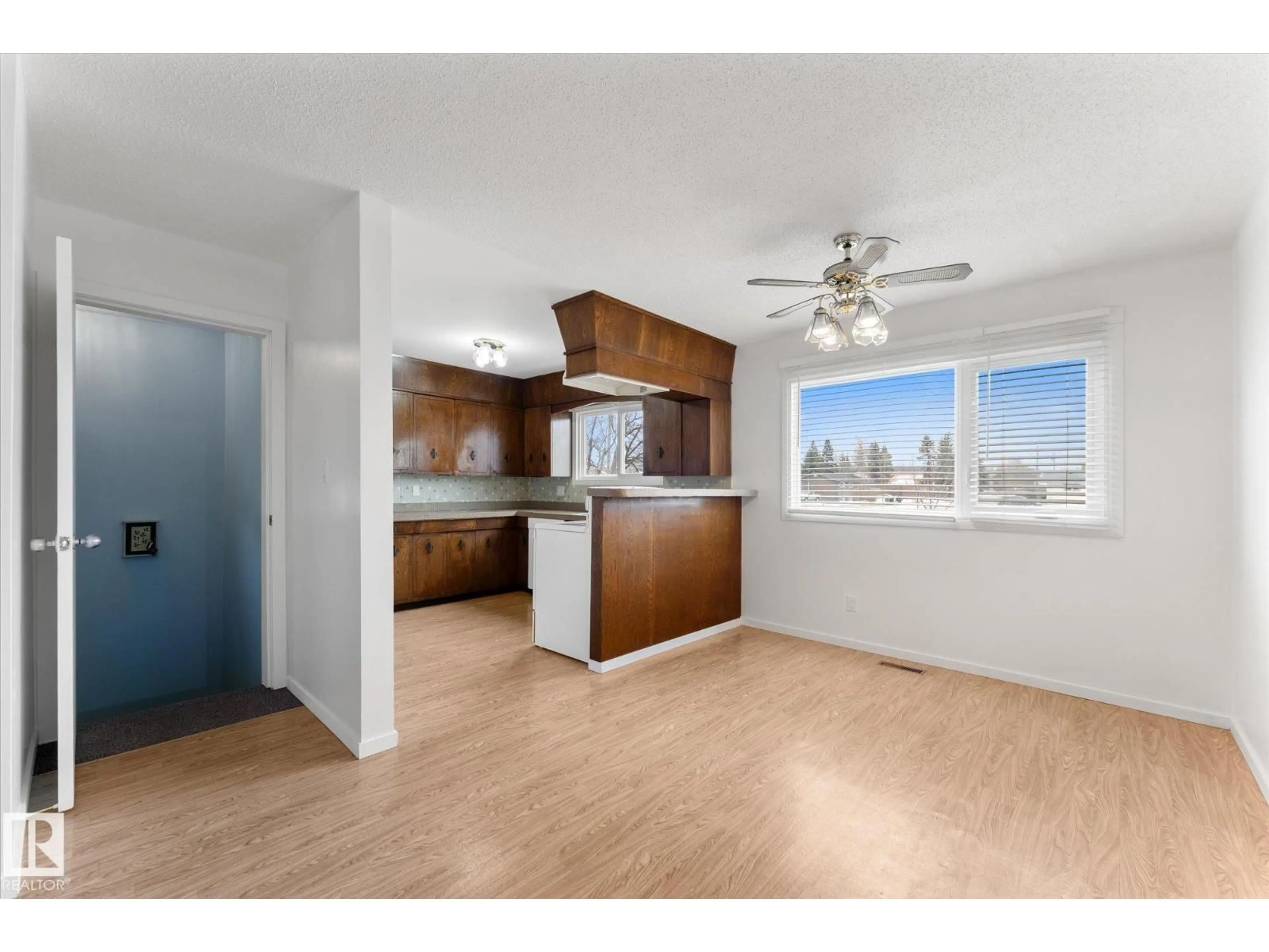 Open concept kitchen, wood/laminate floor for 4520 54 AV, Leduc Alberta T9E5W1