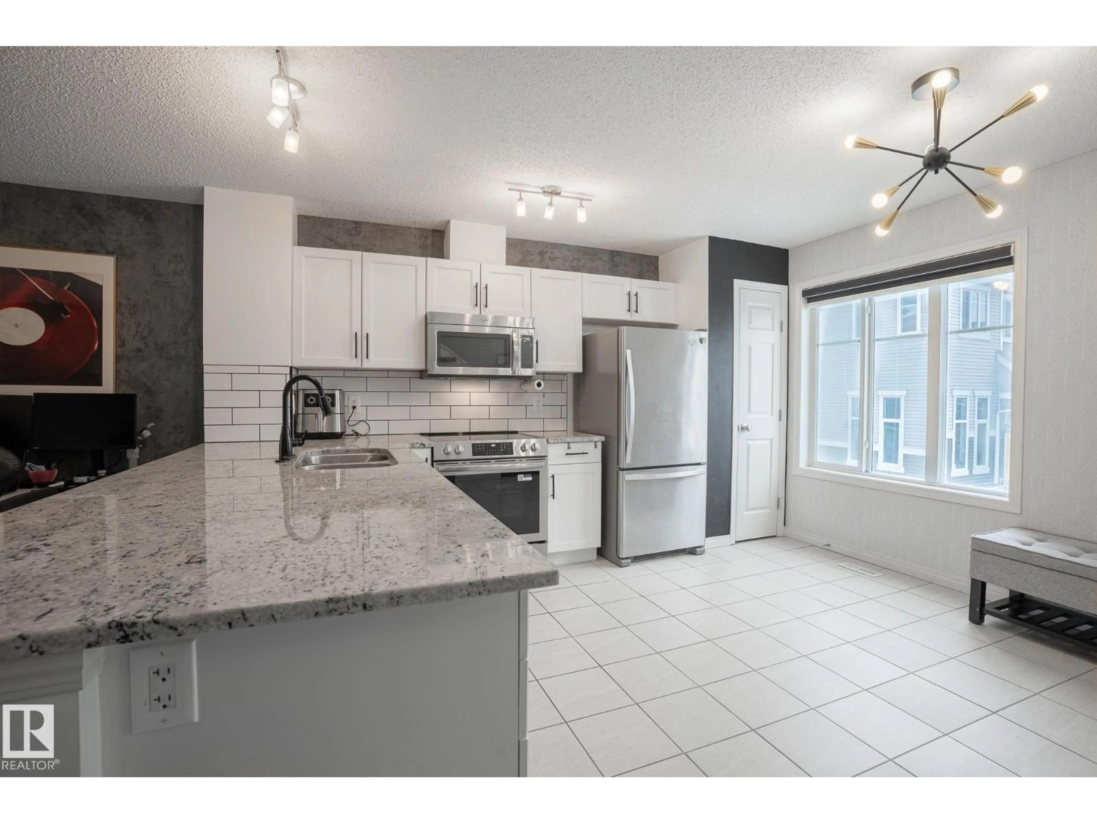 Open concept kitchen, ceramic/tile floor for #13 - 2905 141 ST, Edmonton Alberta T6W1S4