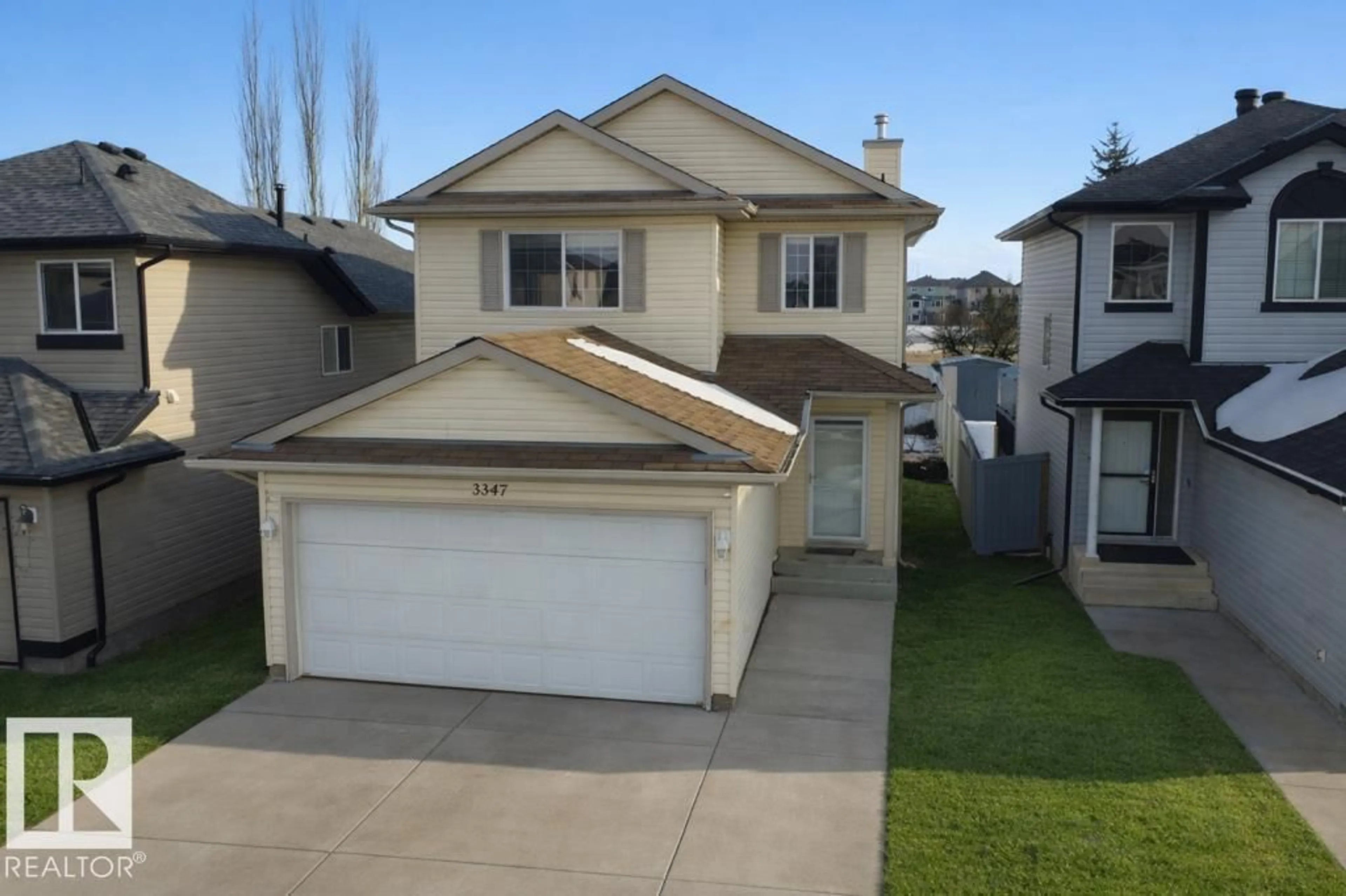 Home with vinyl exterior material, street for 3347 24 AV, Edmonton Alberta T6T1Y5