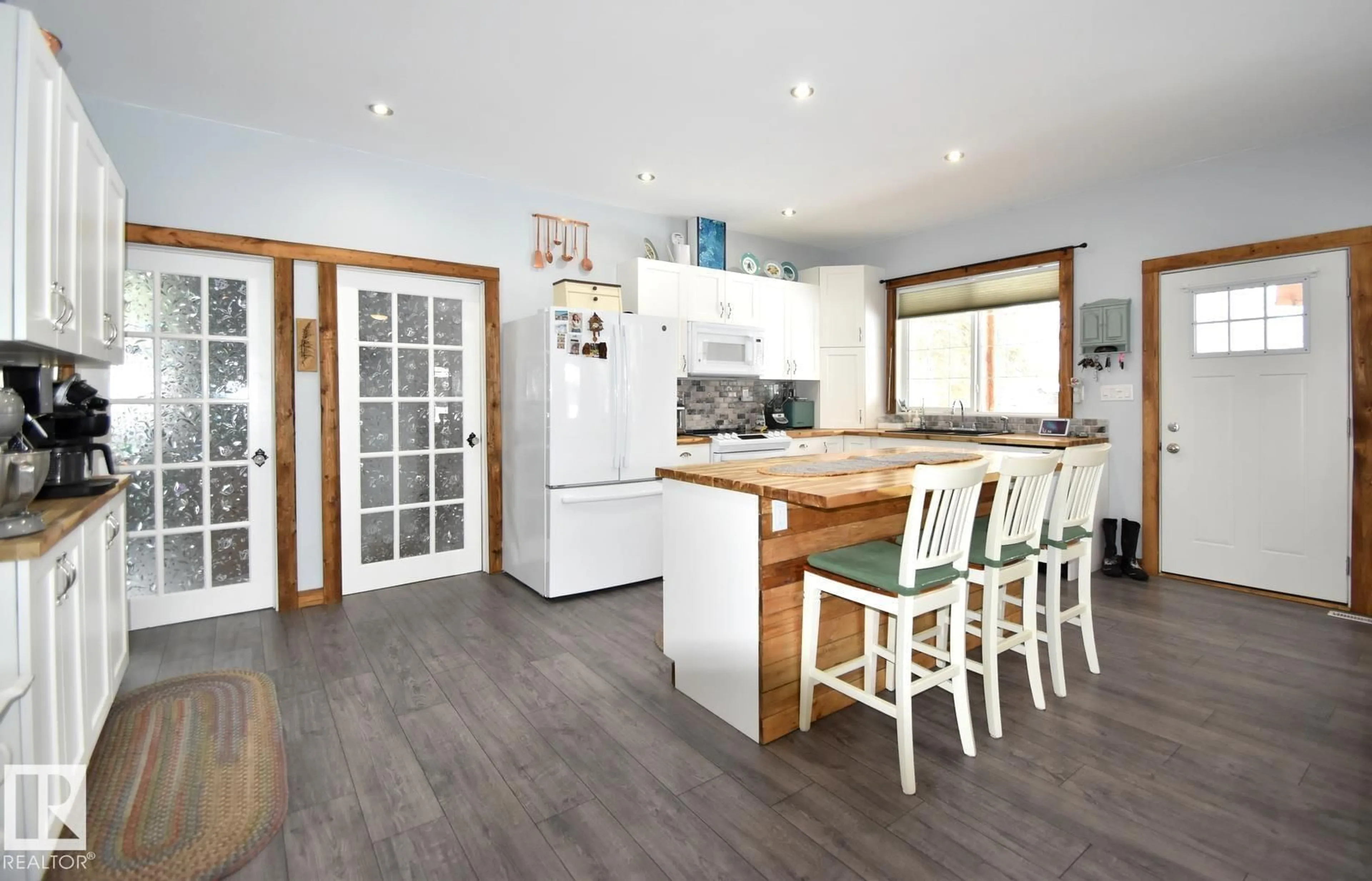 Open concept kitchen, wood/laminate floor for 309 DEBBIE DR, Rural Athabasca County Alberta T0A0M0