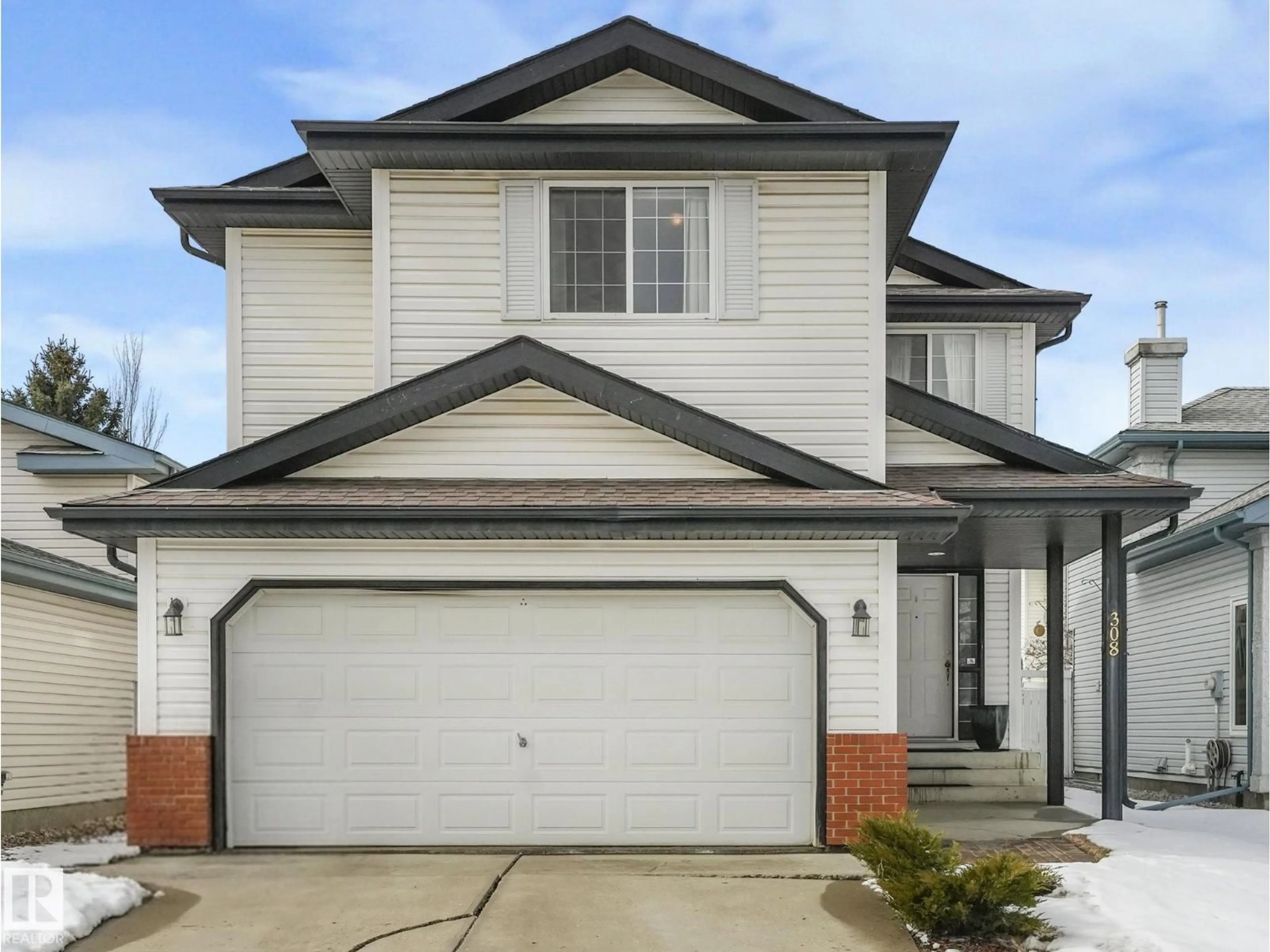 Home with vinyl exterior material, street for 308 BERINGER CR, Edmonton Alberta T5T6R6