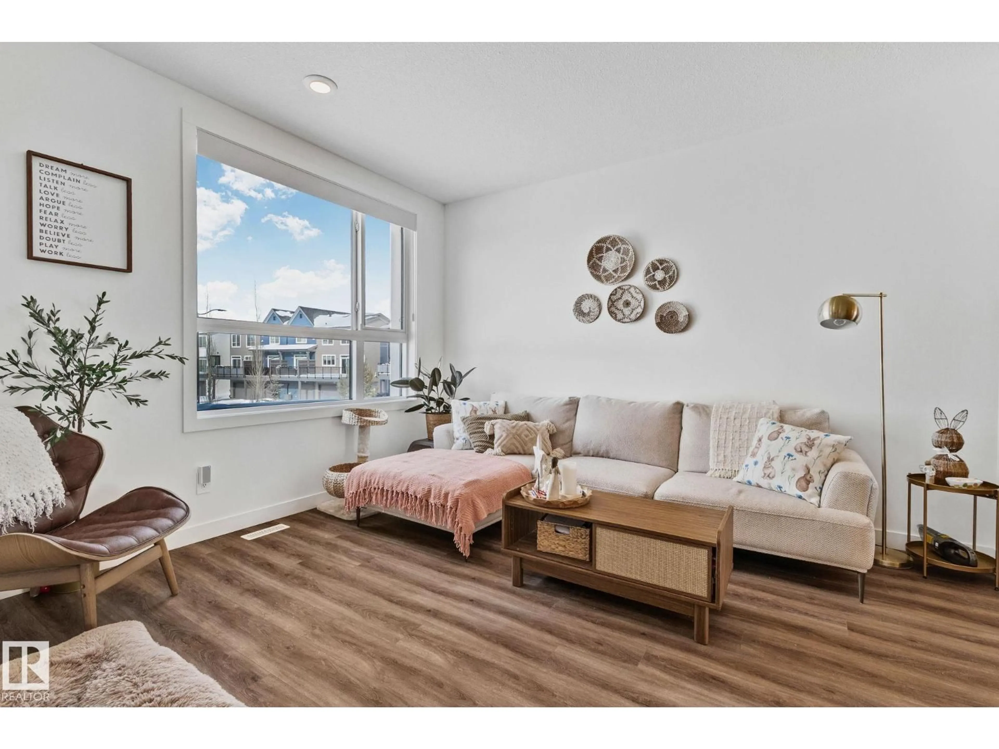 Living room with furniture, wood/laminate floor for 100 - 38 JENSEN LAKES BLVD., St. Albert Alberta T8N7T9