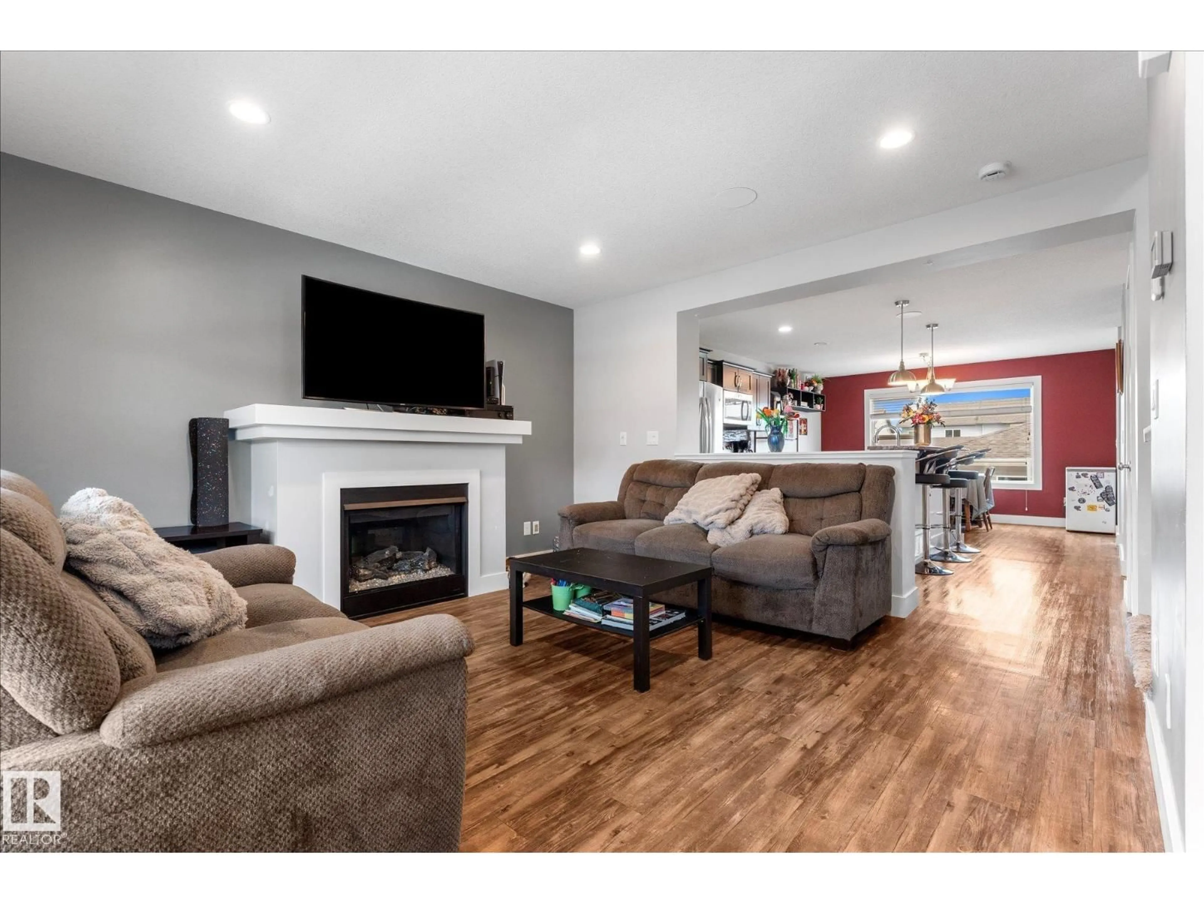 Living room with furniture, wood/laminate floor for 4126 6A ST, Edmonton Alberta T6T0T6