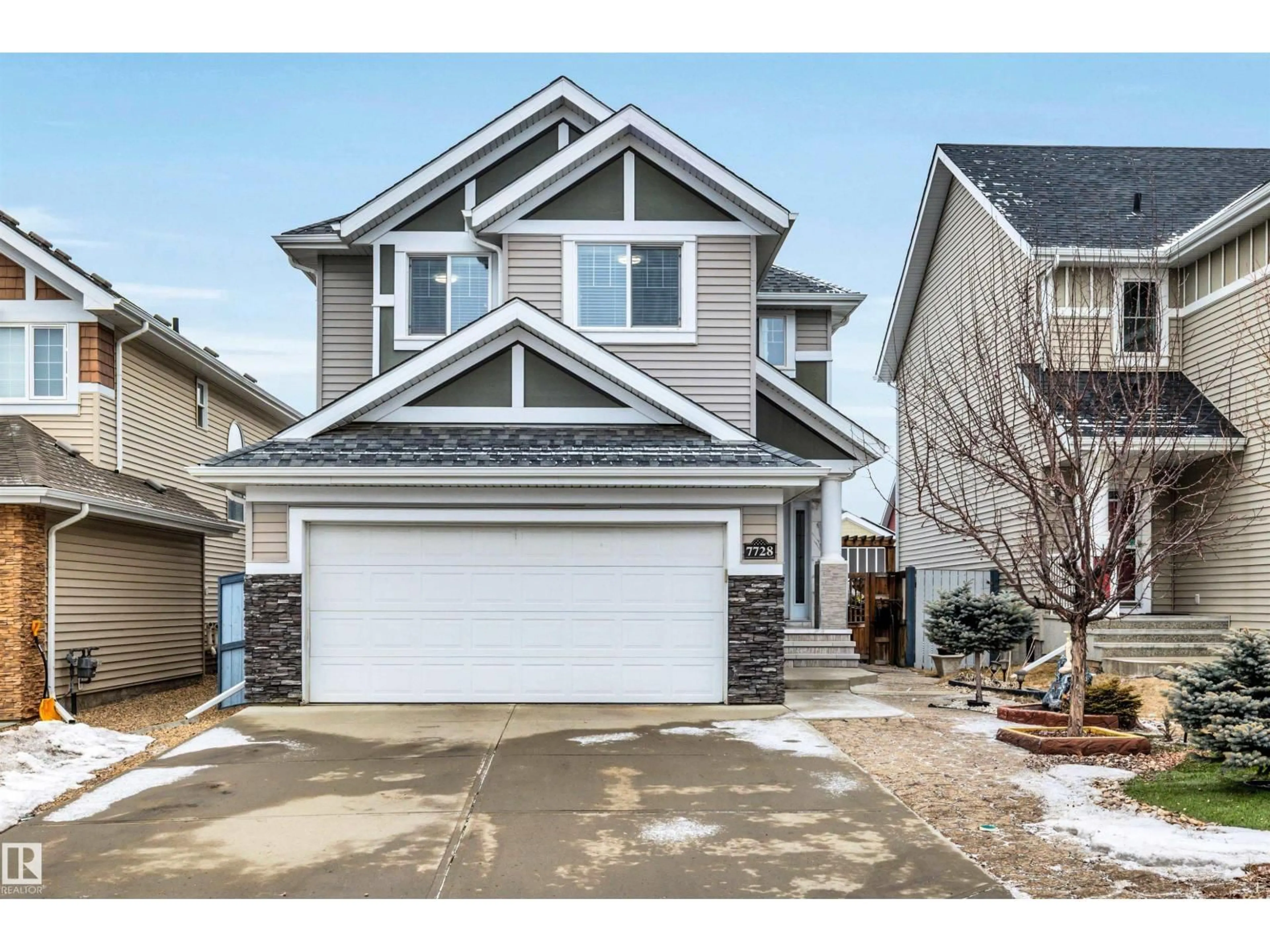 Home with vinyl exterior material, street for 7728 18 AV, Edmonton Alberta T6X0V3