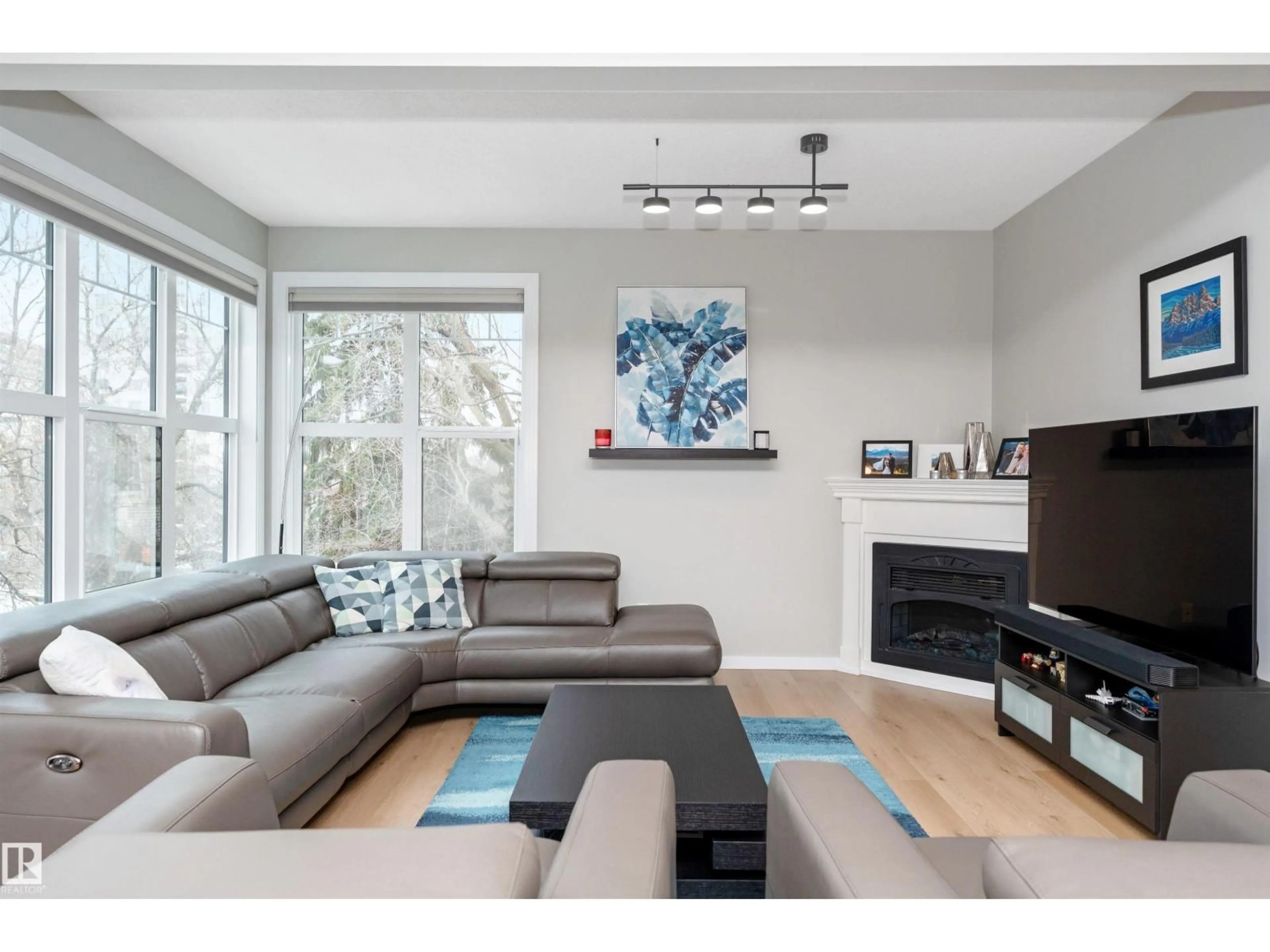 Living room with furniture, wood/laminate floor for #303 - 9828 112 ST NW, Edmonton Alberta T5K1L4