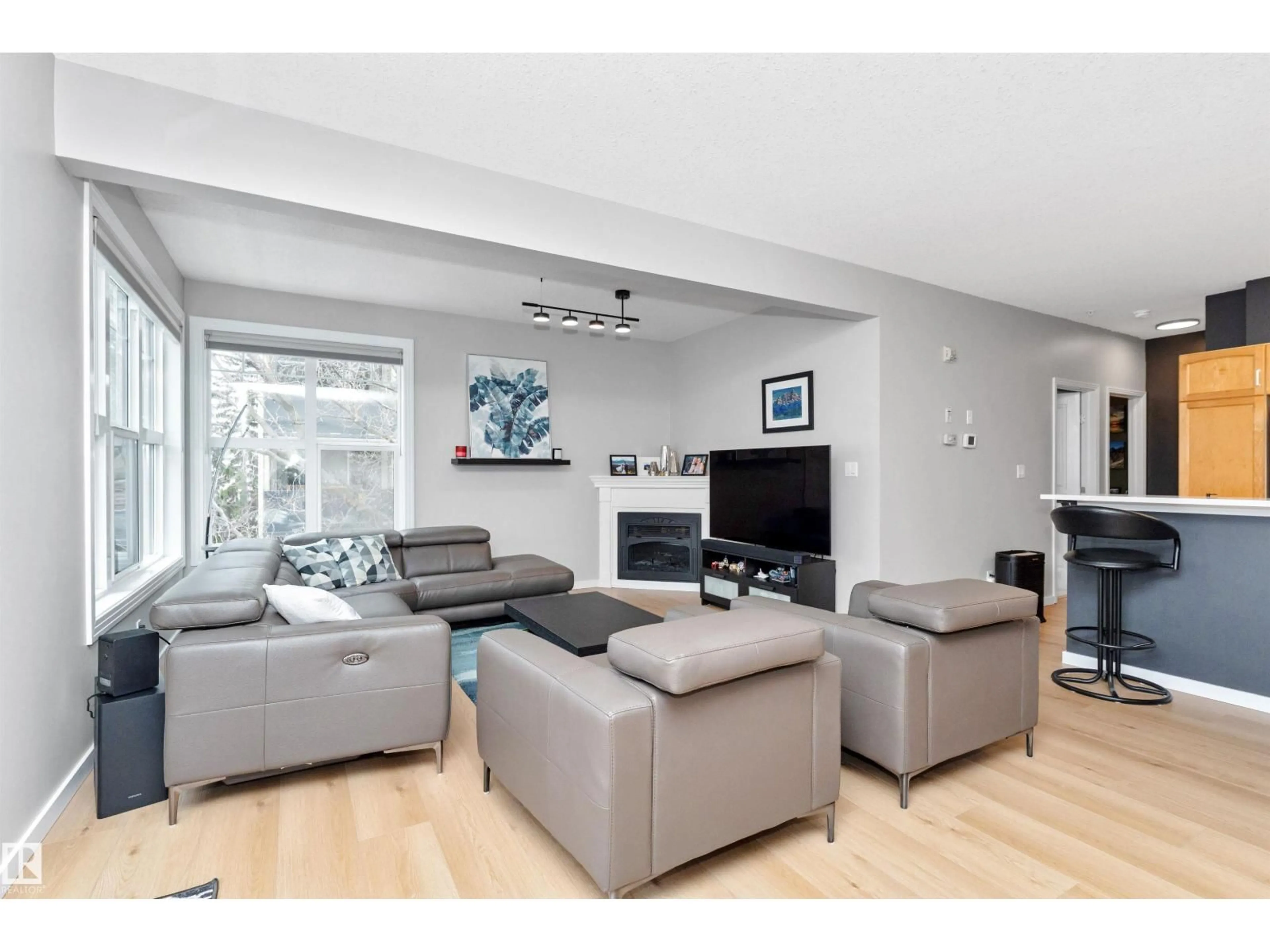 Living room with furniture, wood/laminate floor for #303 - 9828 112 ST NW, Edmonton Alberta T5K1L4