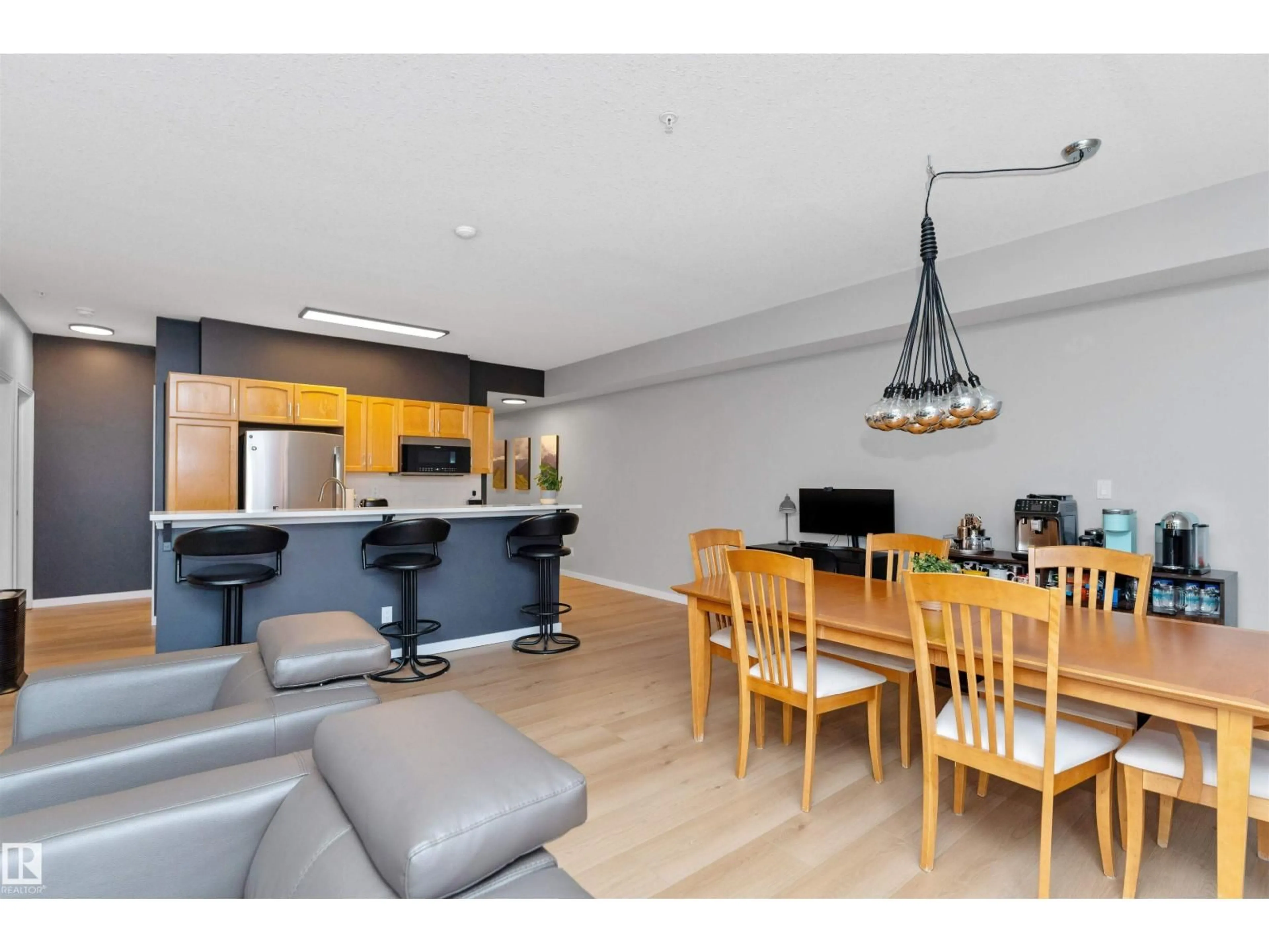 Open concept kitchen, wood/laminate floor for #303 - 9828 112 ST NW, Edmonton Alberta T5K1L4