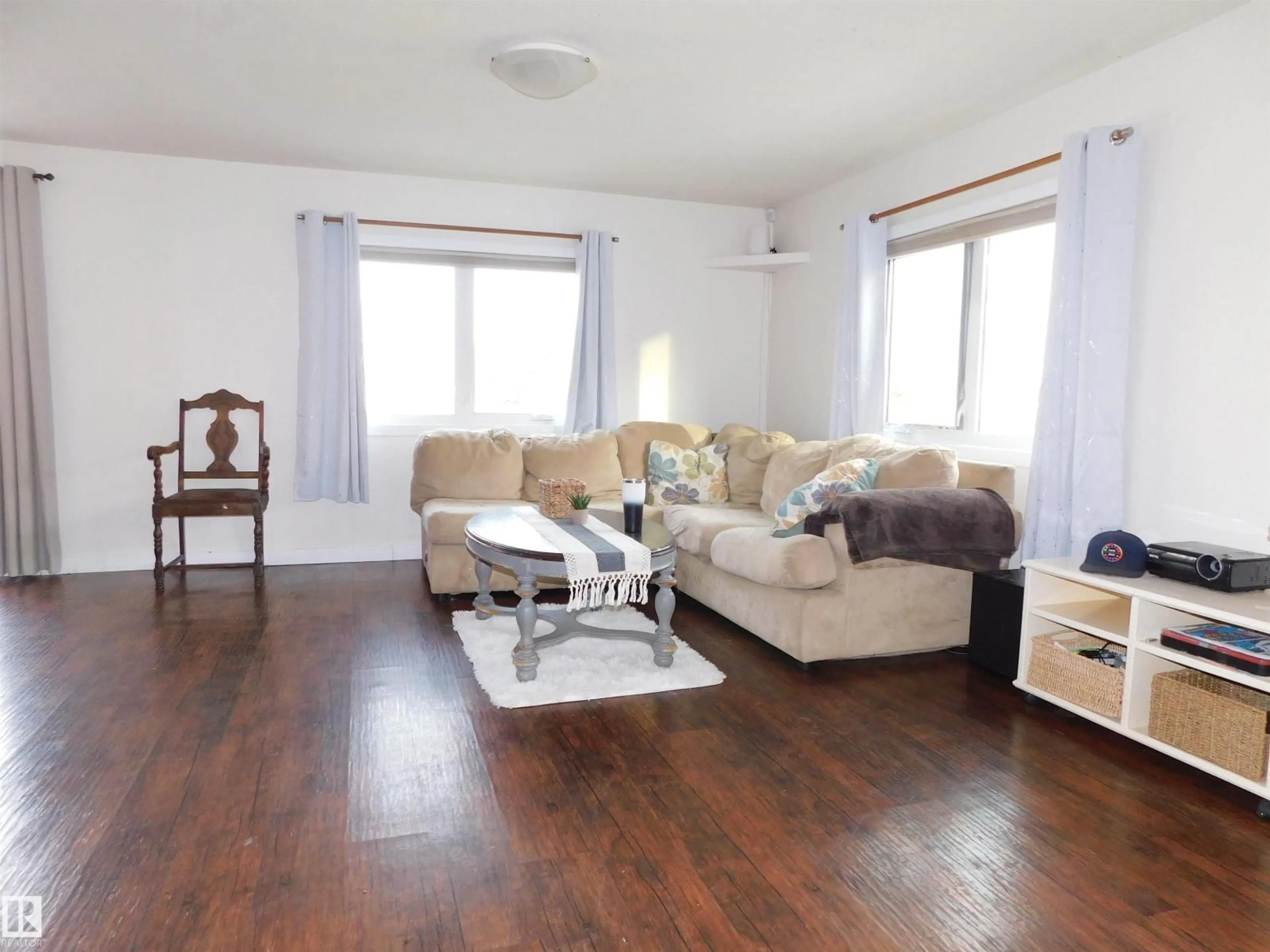 Living room with furniture, wood/laminate floor for 54118 RANGE ROAD 75, Rural Yellowhead Alberta T0E0T0