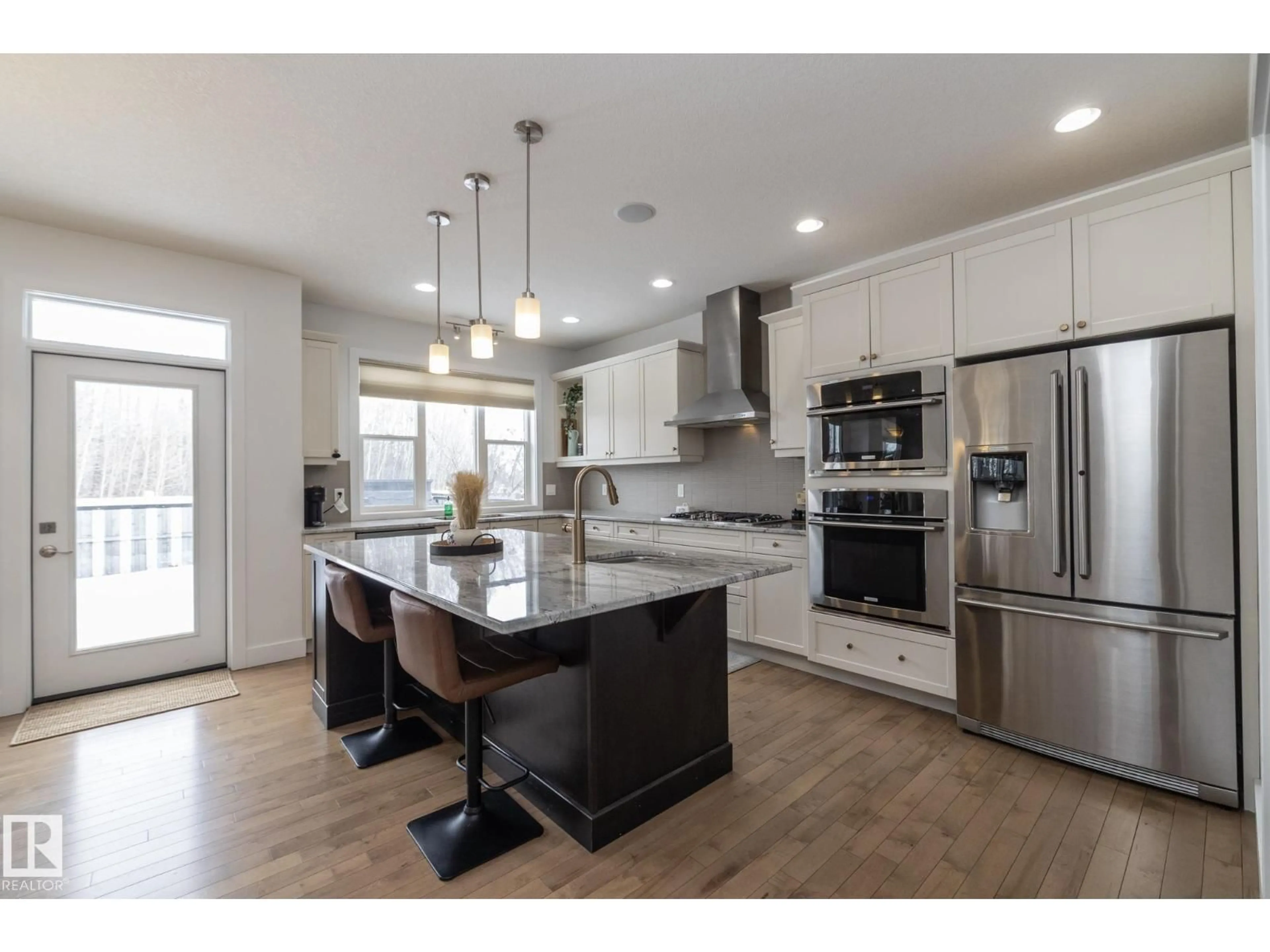 Open concept kitchen, wood/laminate floor for 14 EDGEWATER TERR, St. Albert Alberta T8N4G5