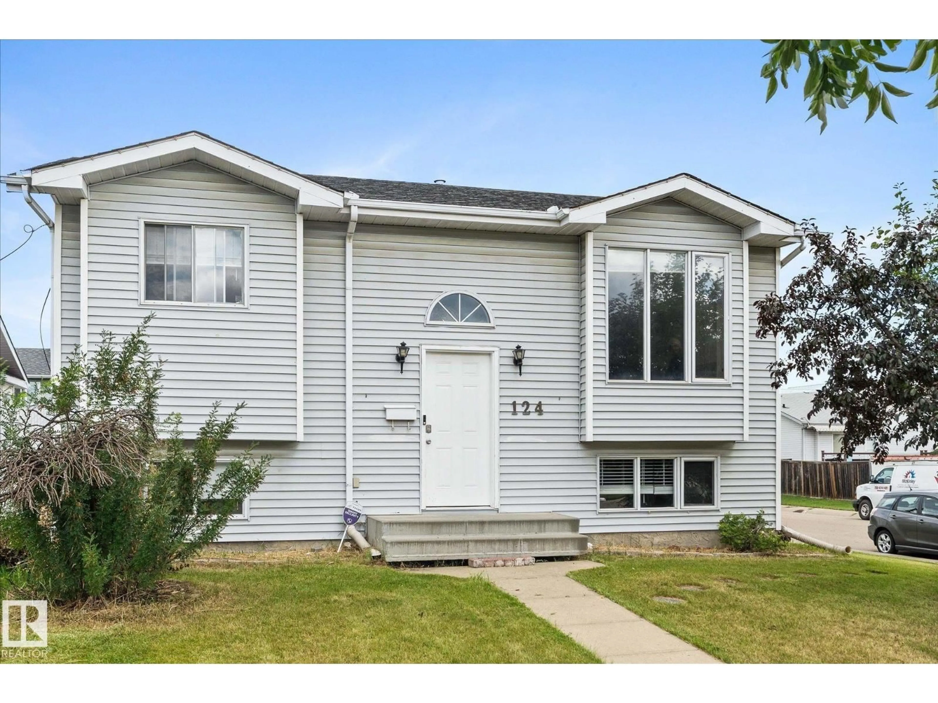 Home with vinyl exterior material, street for 124 KLARVATTEN RD, Edmonton Alberta T5Z2X4