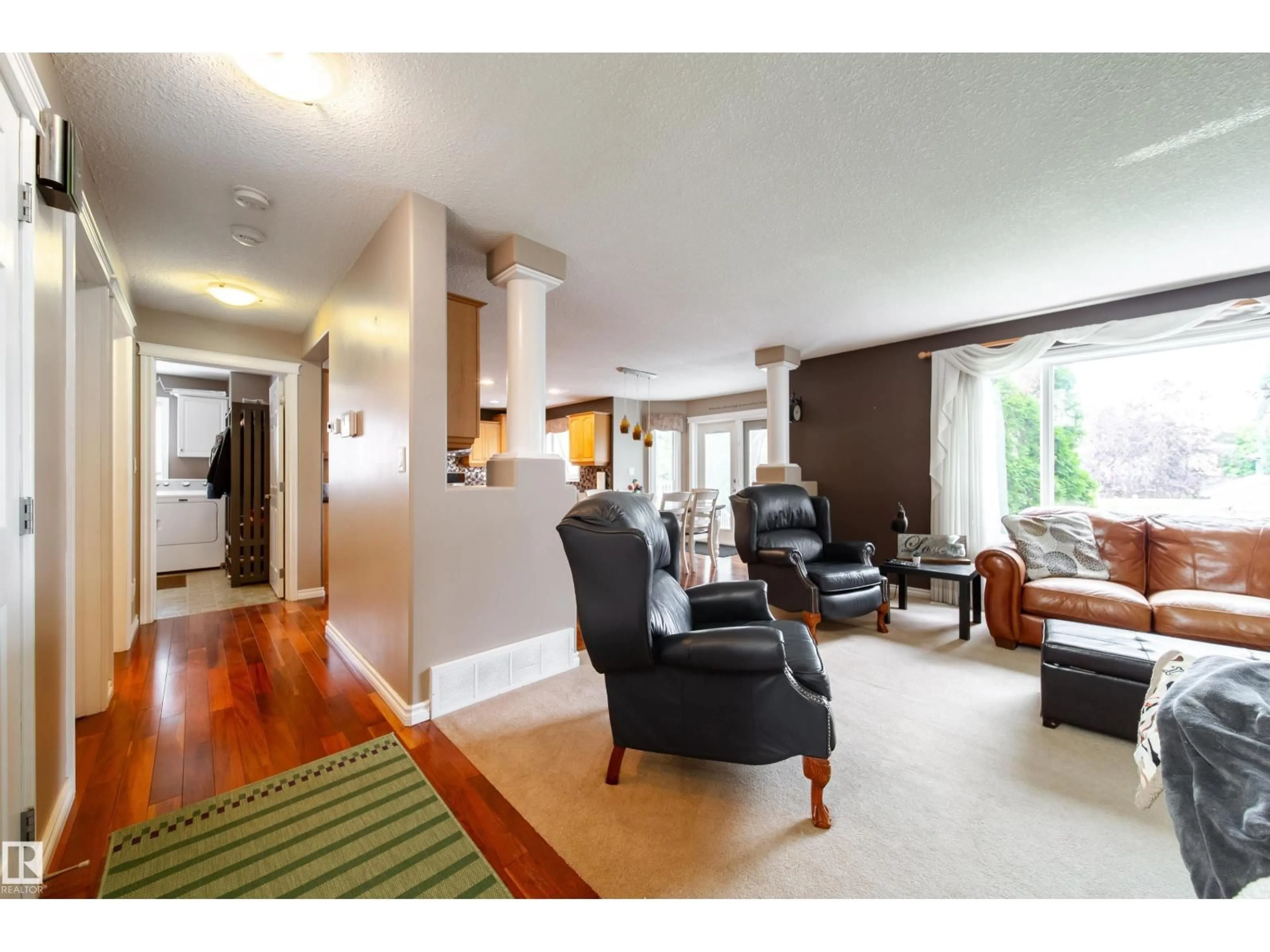 Living room with furniture, wood/laminate floor for 4 WINDROSE DR, Leduc Alberta T9E8E7