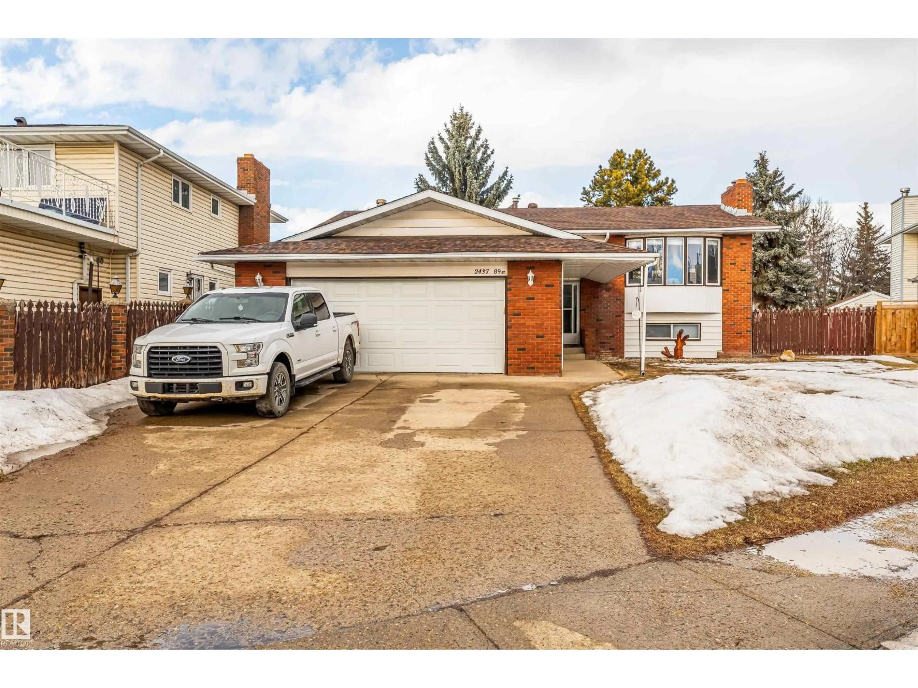 Home with brick exterior material, street for NW - 2437 89 ST, Edmonton Alberta T6K2Y8