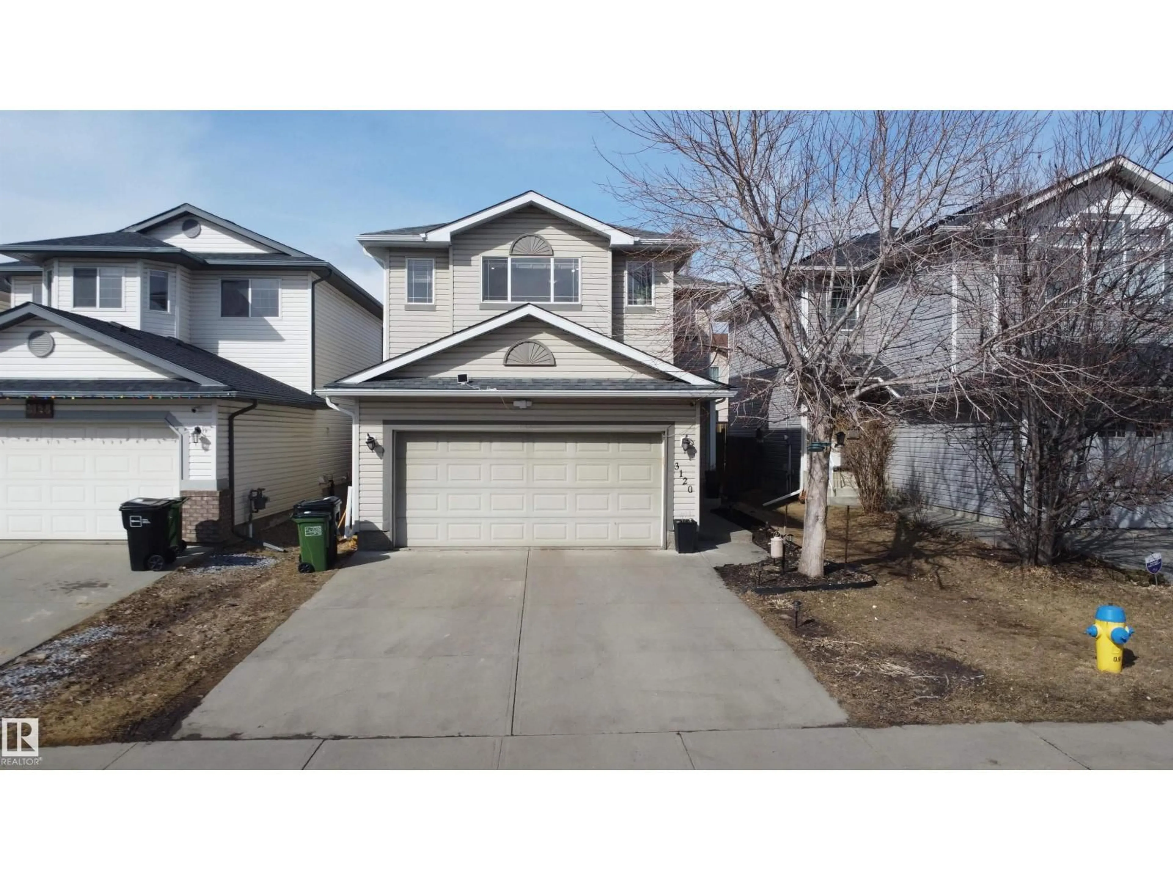 Home with vinyl exterior material, street for 3120 25 AV, Edmonton Alberta T6T0L8