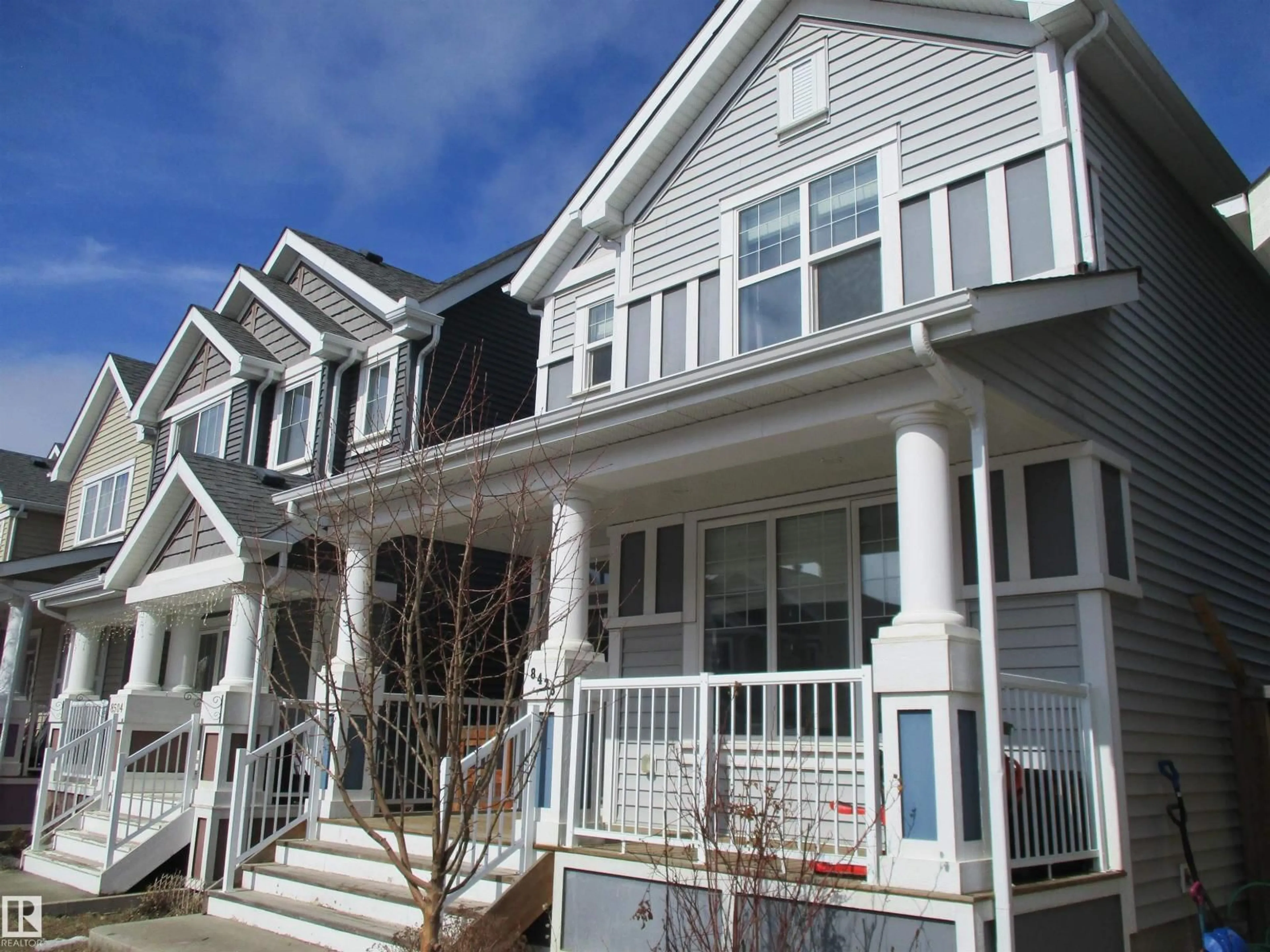 Home with vinyl exterior material, street for SW - 8428 24 AV, Edmonton Alberta T6X2G1