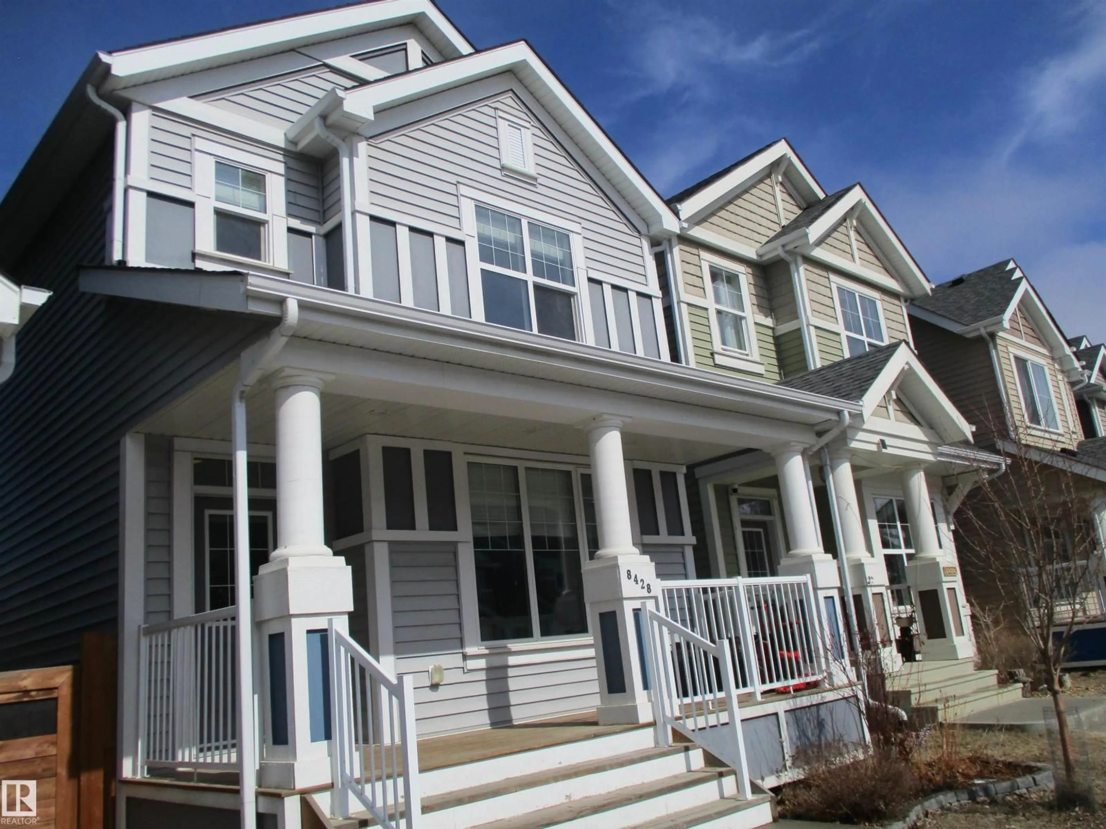 Home with vinyl exterior material, street for SW - 8428 24 AV, Edmonton Alberta T6X2G1