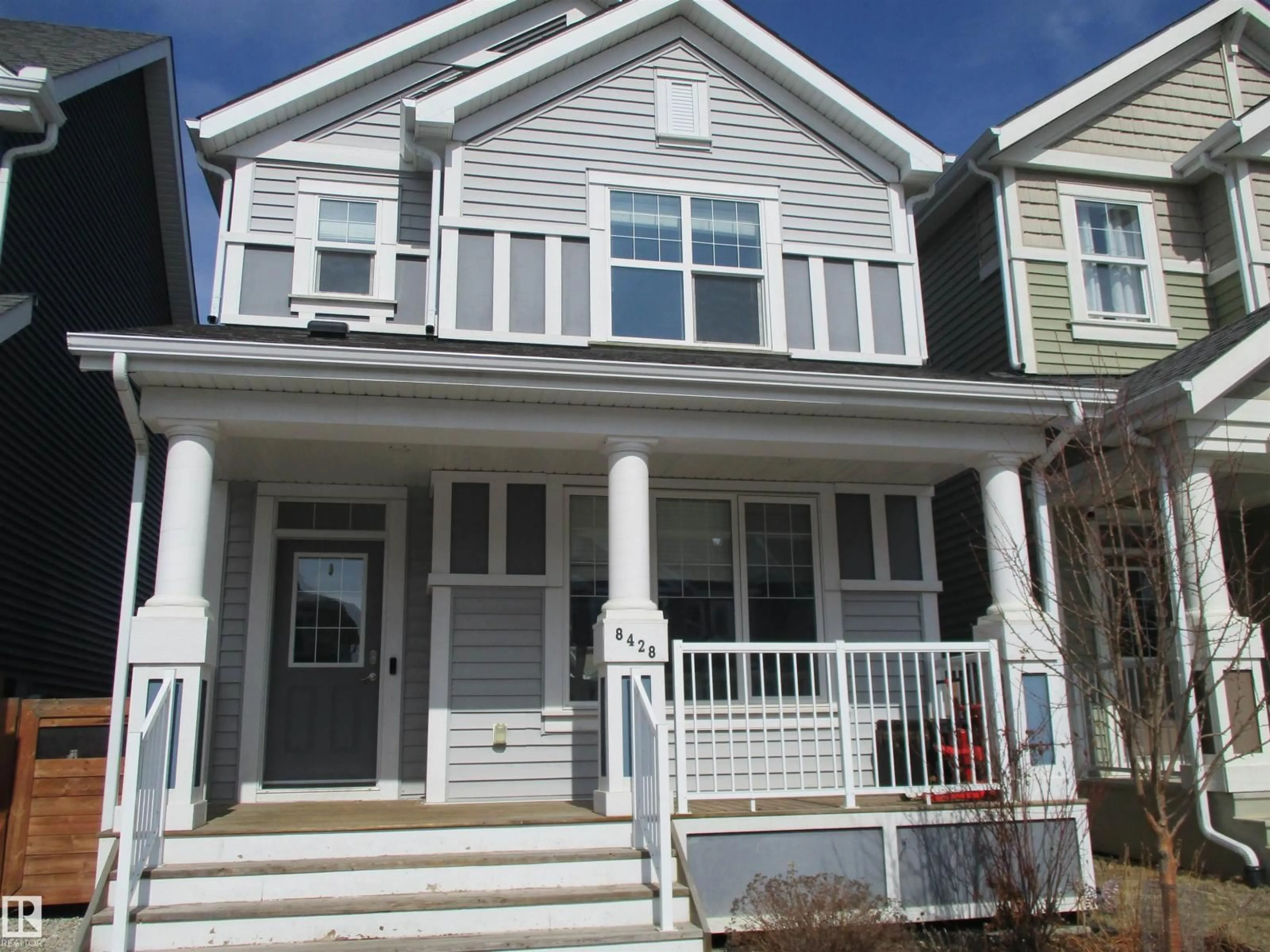 Home with vinyl exterior material, street for SW - 8428 24 AV, Edmonton Alberta T6X2G1