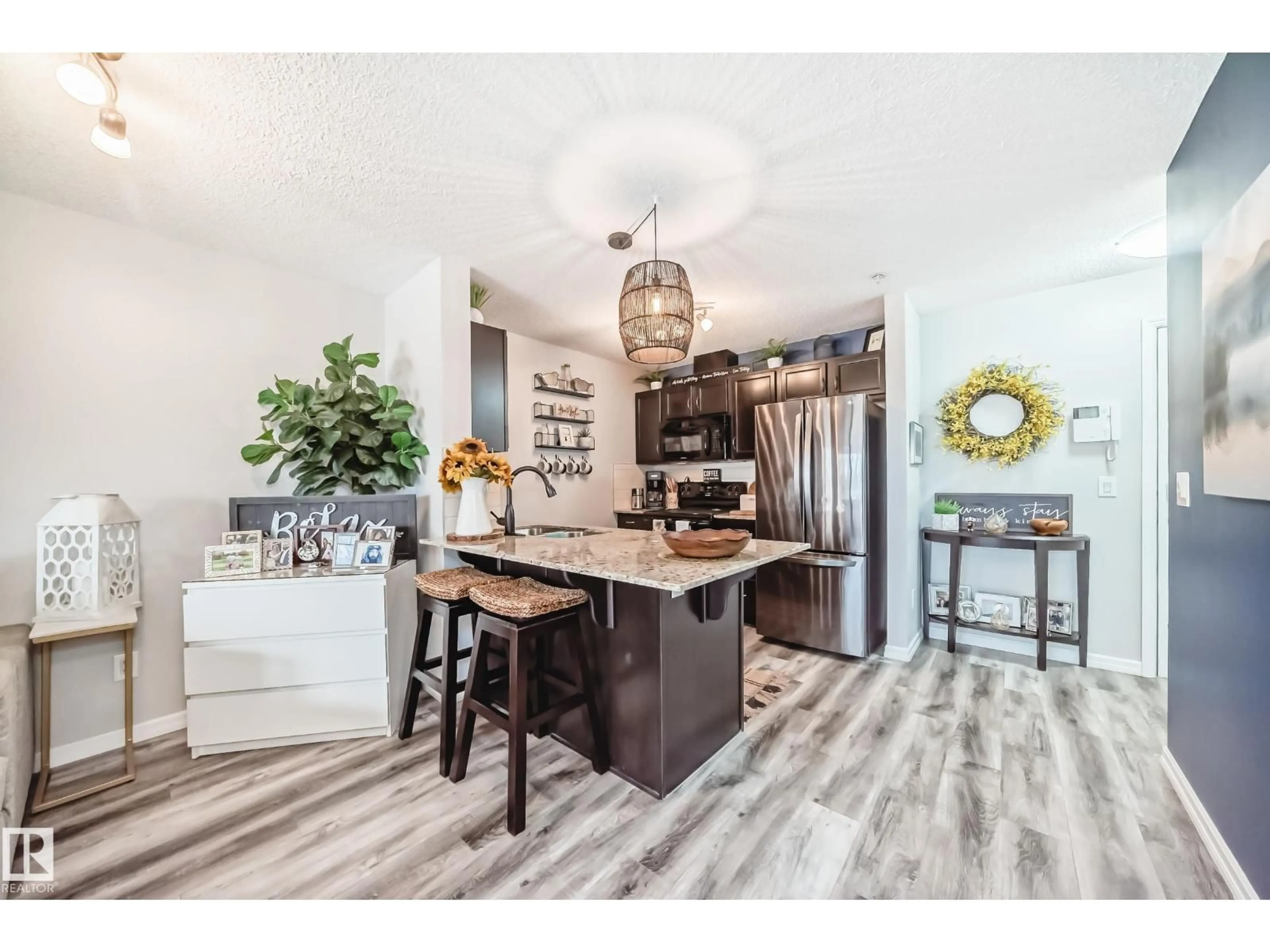 Open concept kitchen, wood/laminate floor for 110 - 271 CHARLOTTE WY, Sherwood Park Alberta T8N0N9