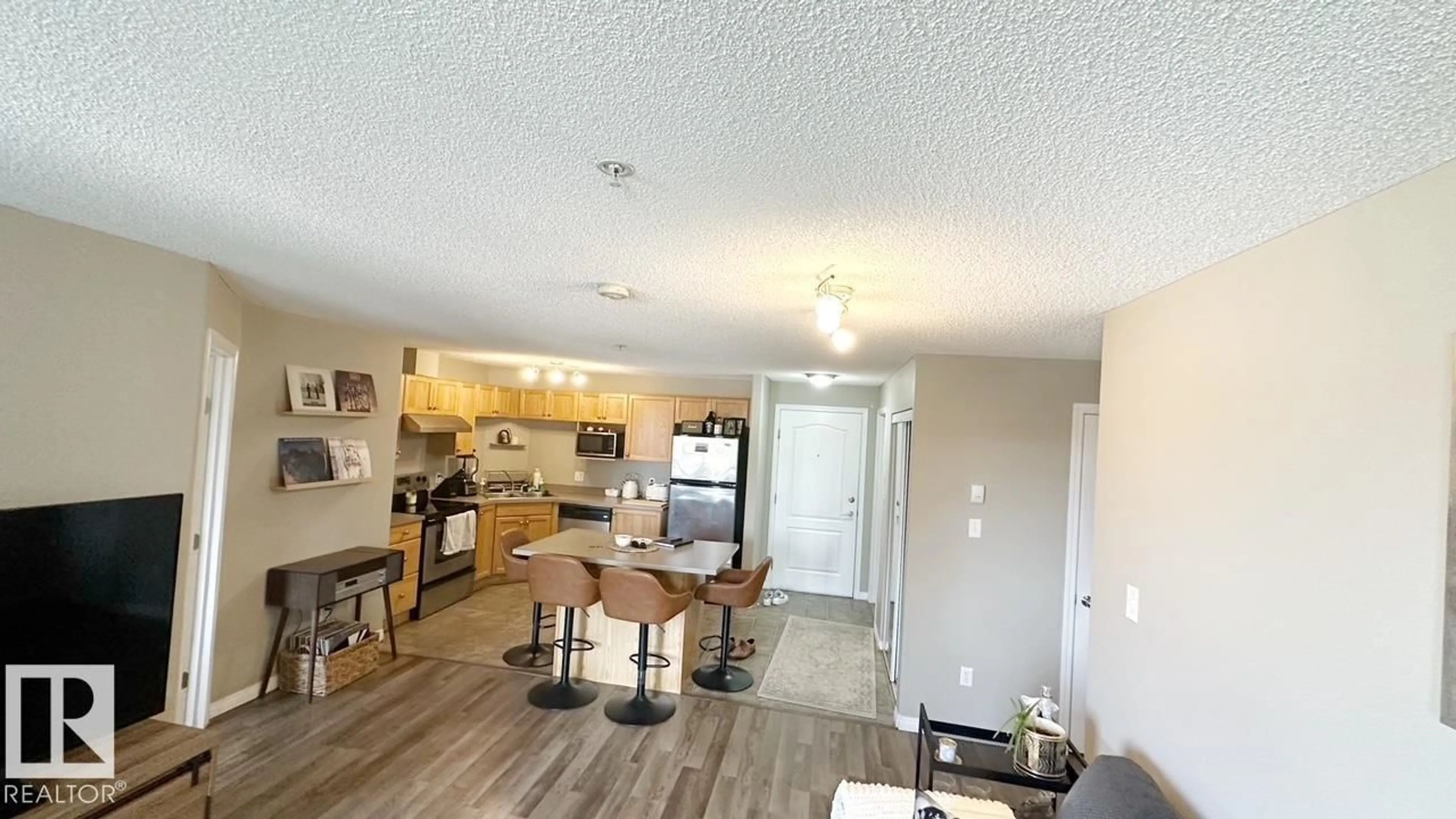 Open concept kitchen, wood/laminate floor for 9363 - 1112 SIMPSON DR, Edmonton Alberta T6R0N2