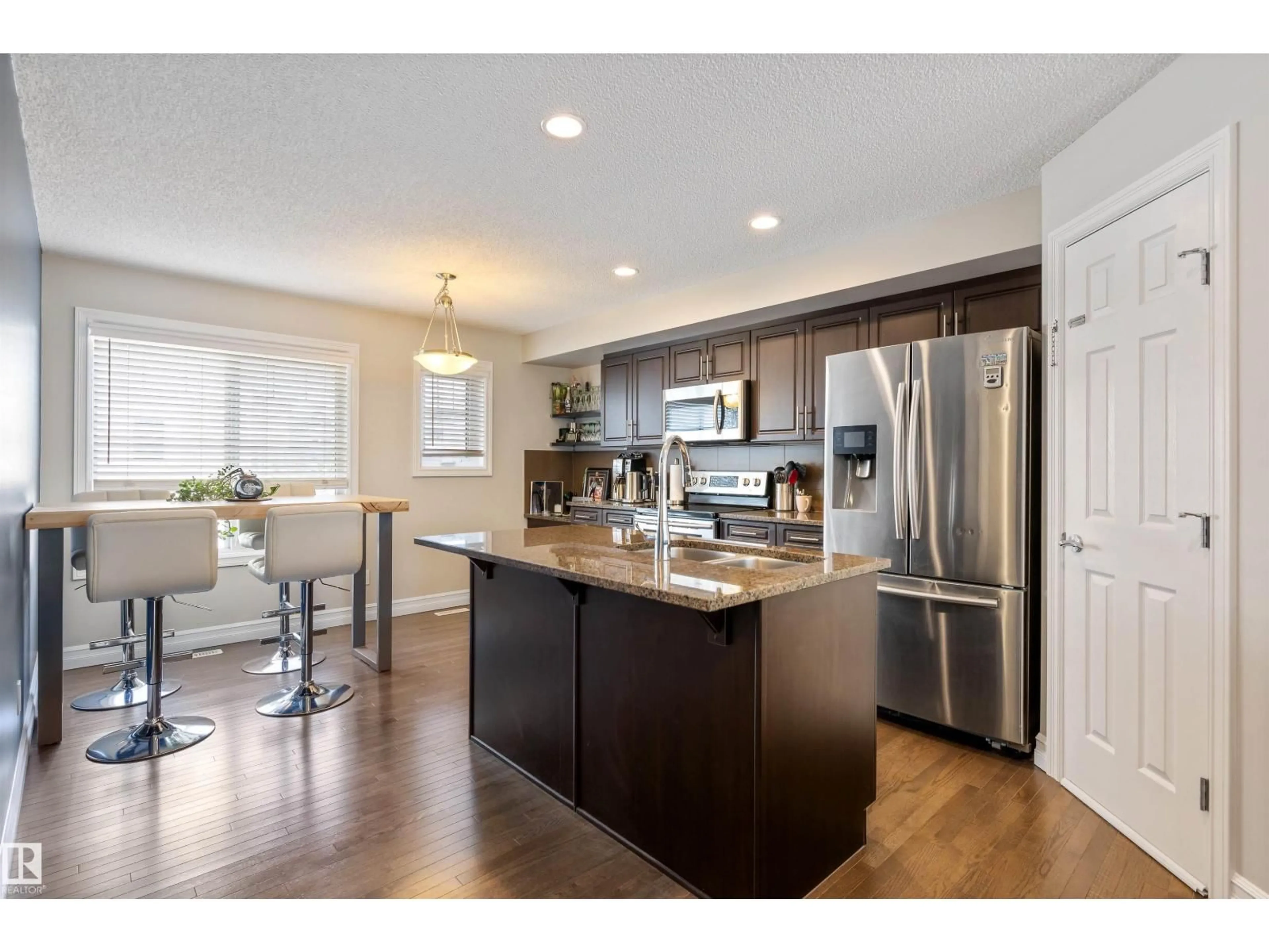 Open concept kitchen, wood/laminate floor for 655 - 64 TAMARACK RD, Edmonton Alberta T6T0N4