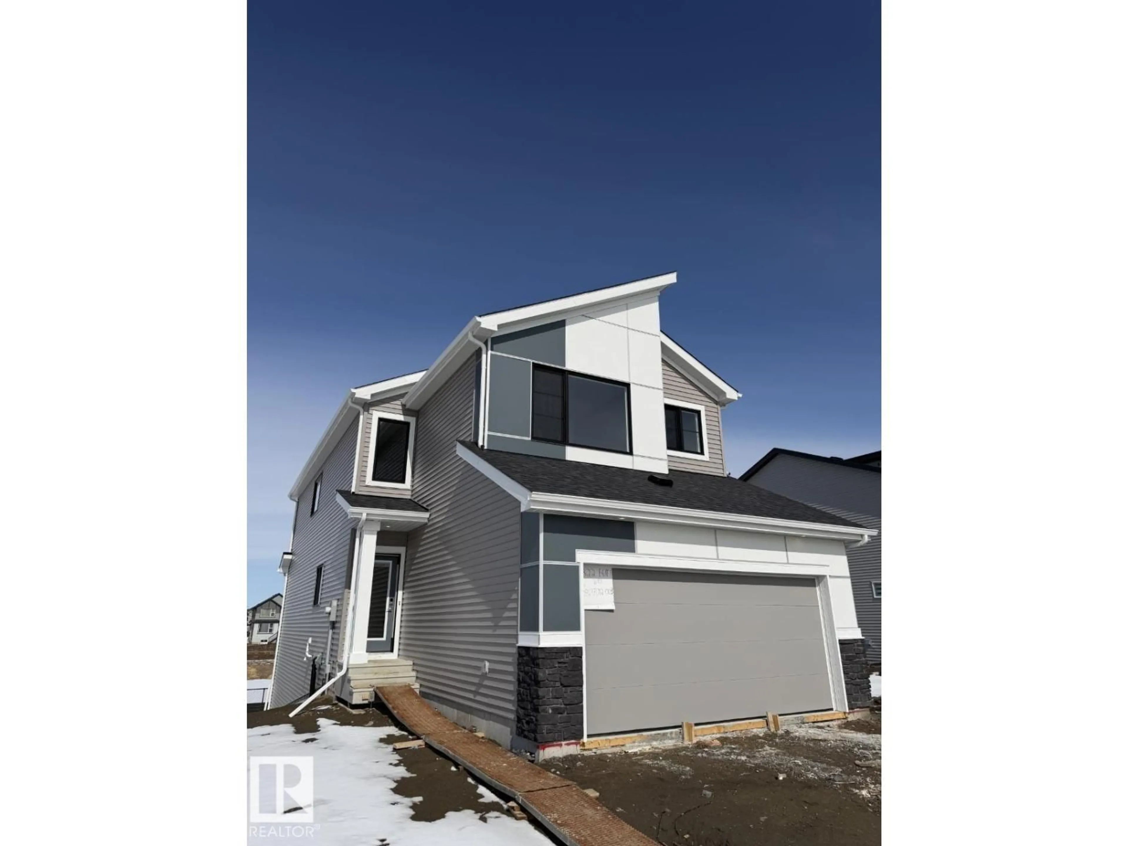 Home with vinyl exterior material, street for 2322 EGRET WY, Edmonton Alberta T6M3G8