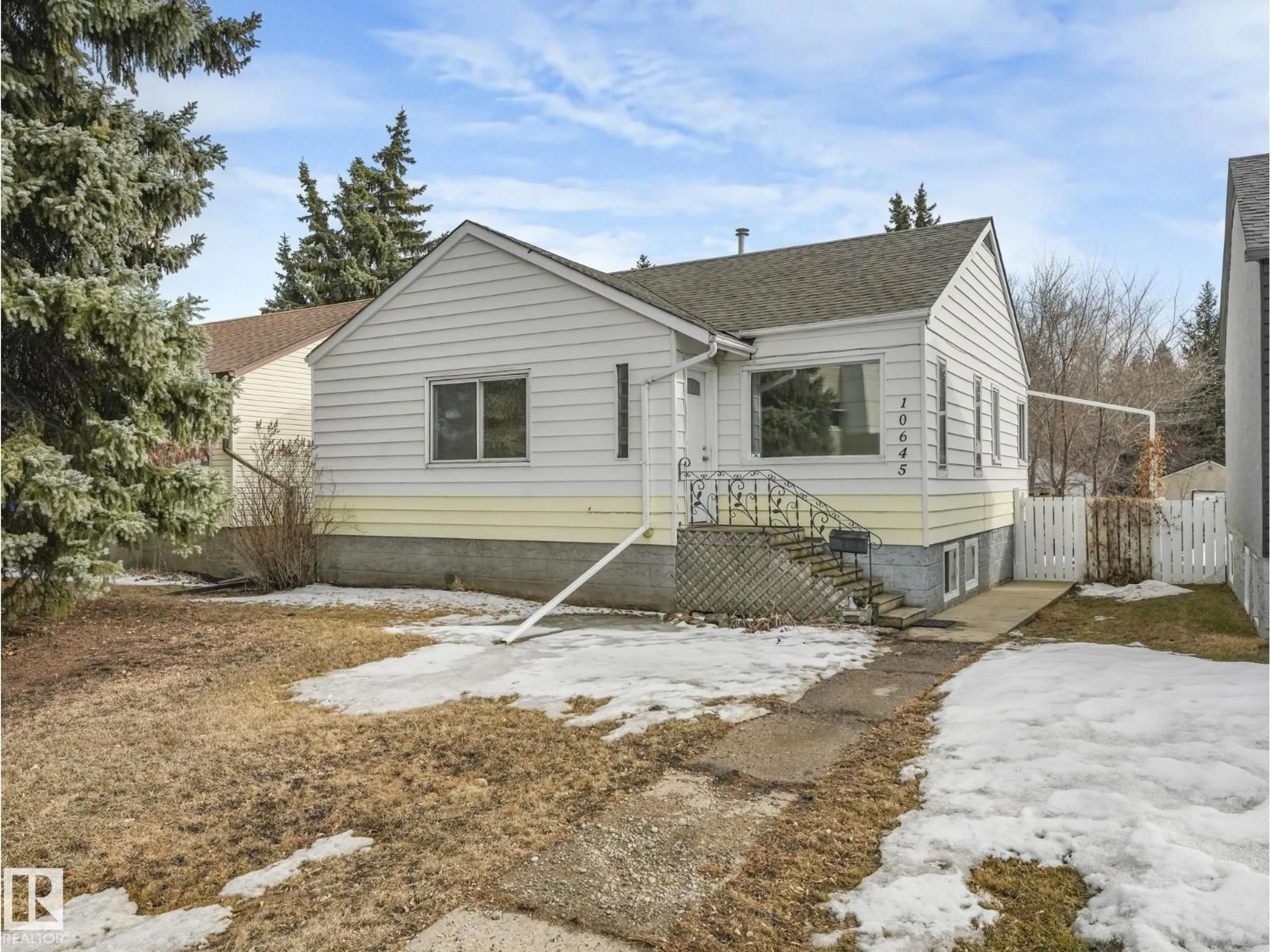 Home with vinyl exterior material, street for 10645 62 AV, Edmonton Alberta T6H1M7
