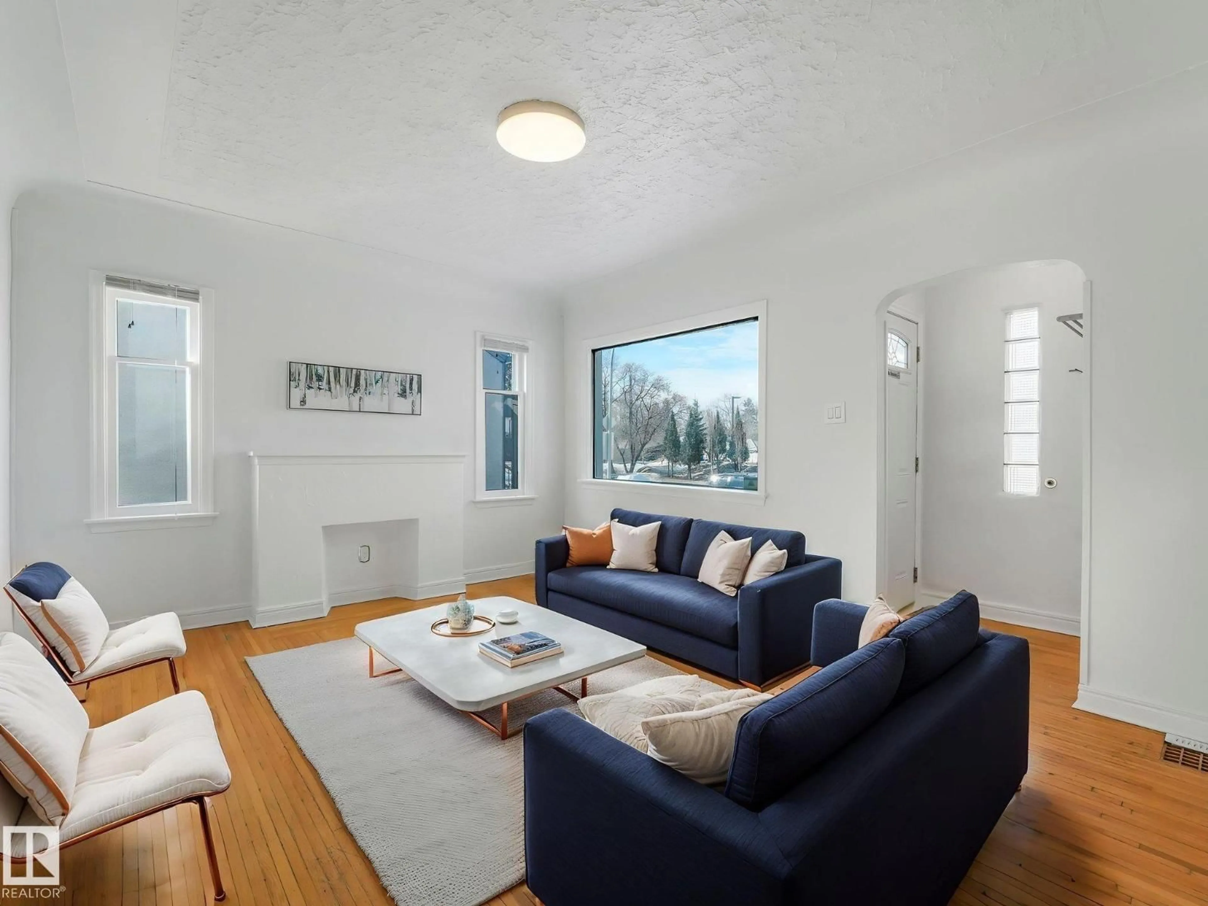 Living room with furniture, unknown for 10645 62 AV, Edmonton Alberta T6H1M7