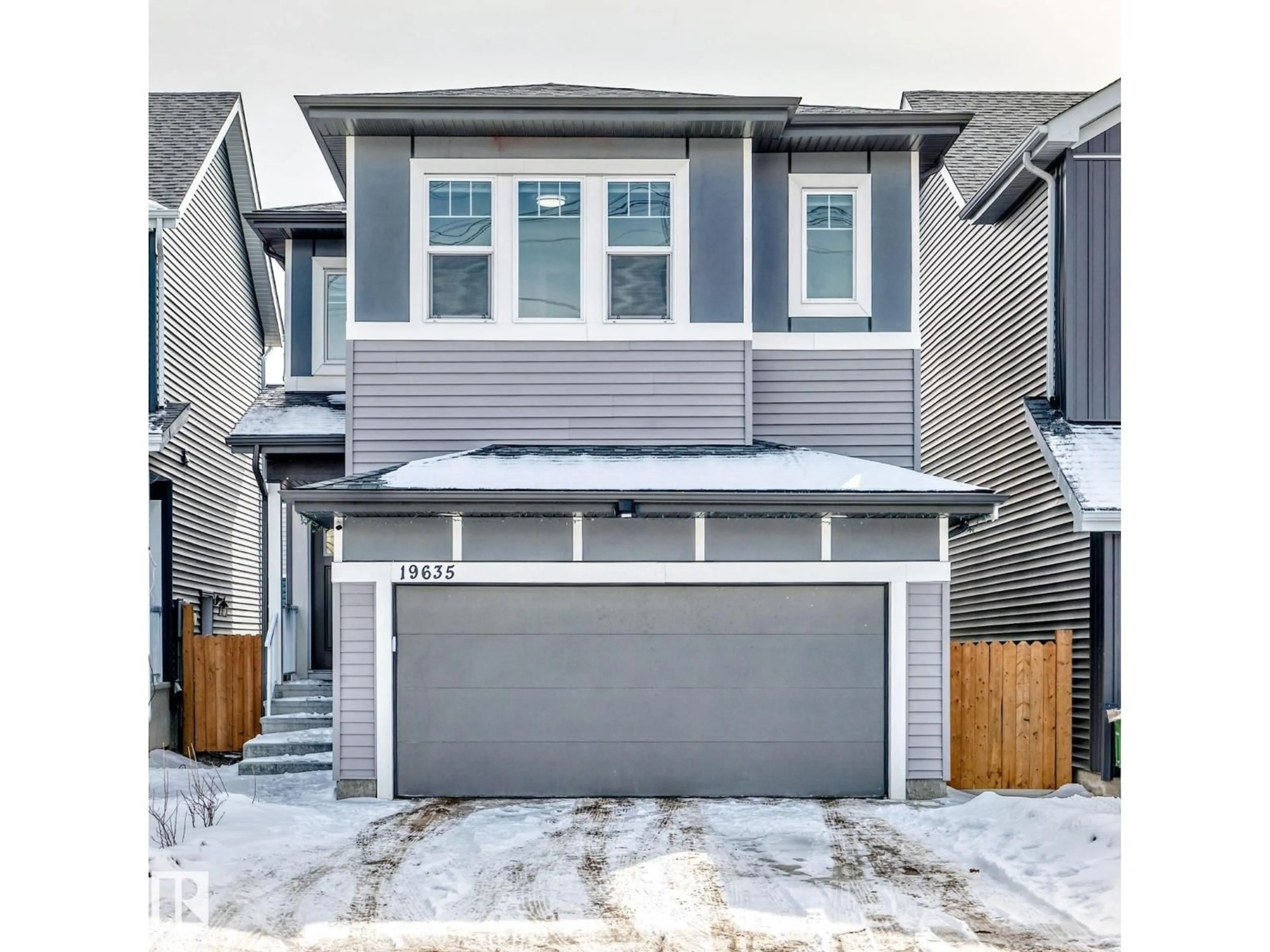 Home with vinyl exterior material, street for 19635 29 AV, Edmonton Alberta T6M1M2