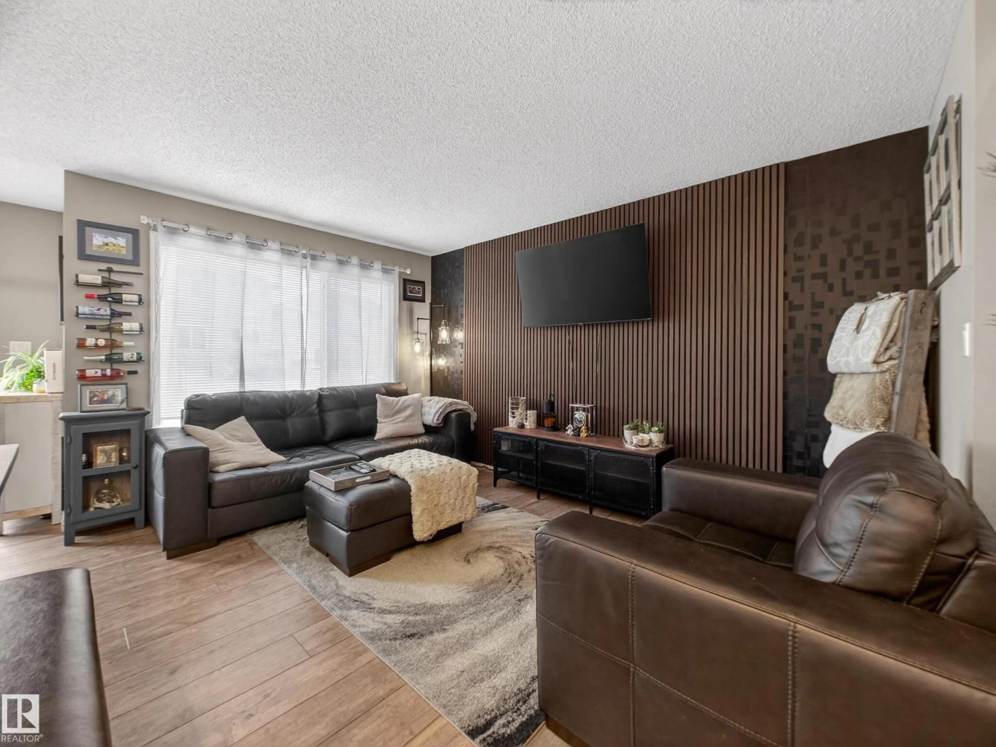 Living room with furniture, wood/laminate floor for NW - 4465 5A ST, Edmonton Alberta T6T0Z8