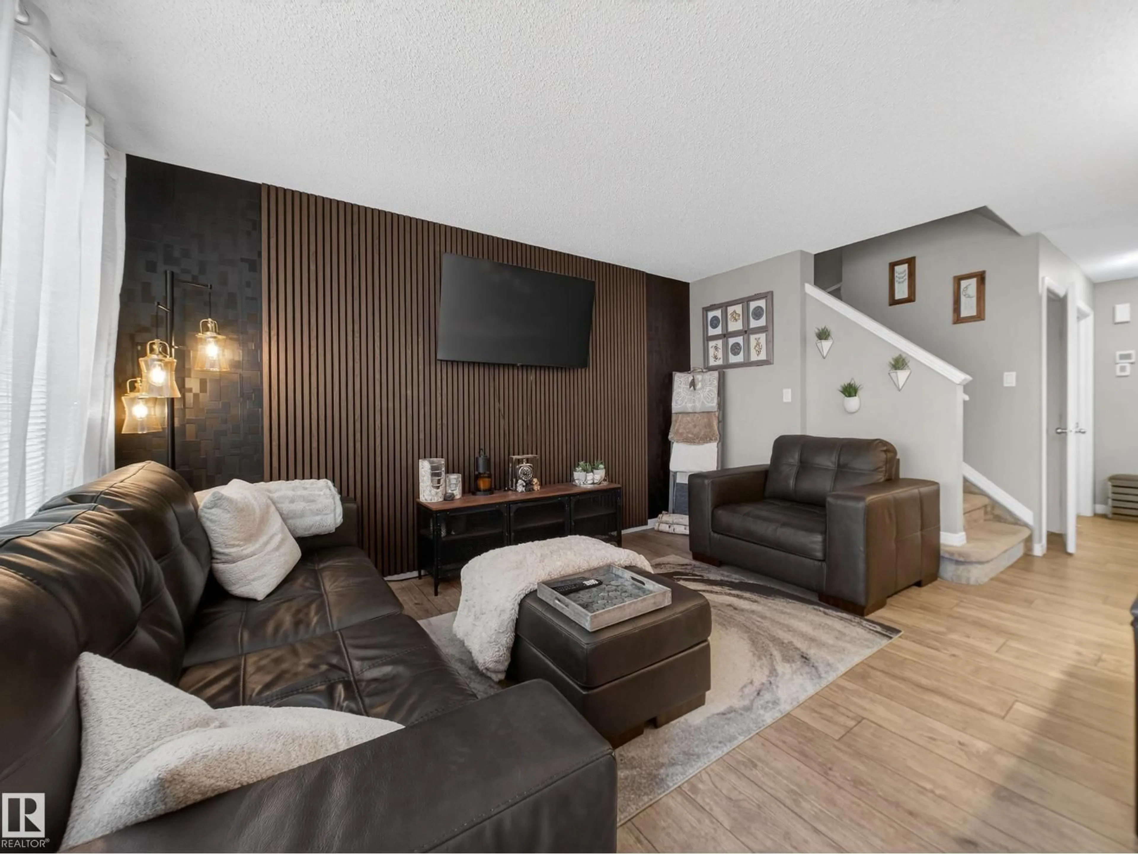 Living room with furniture, wood/laminate floor for NW - 4465 5A ST, Edmonton Alberta T6T0Z8